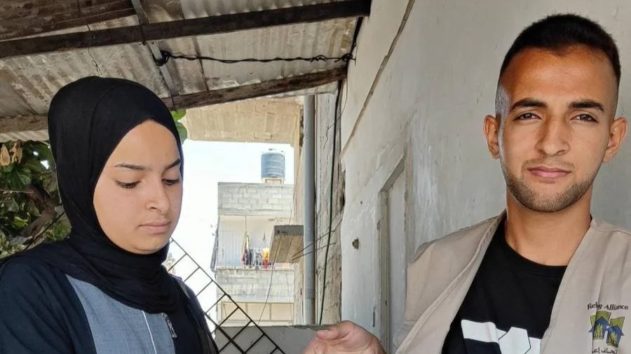 Distributing food parcels to 496 families with malnourished children