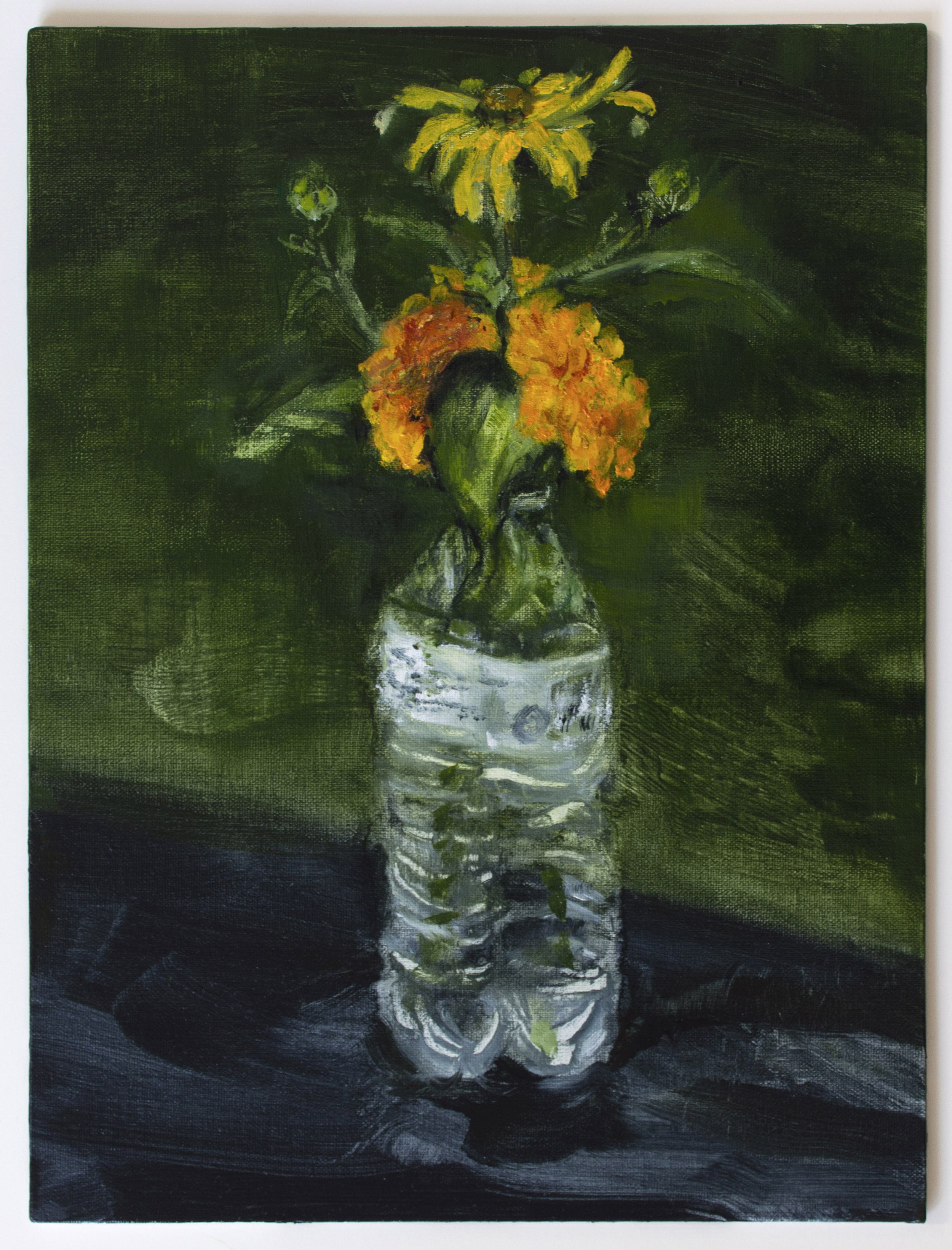 Black-eyed Susan and marigolds in a water bottle