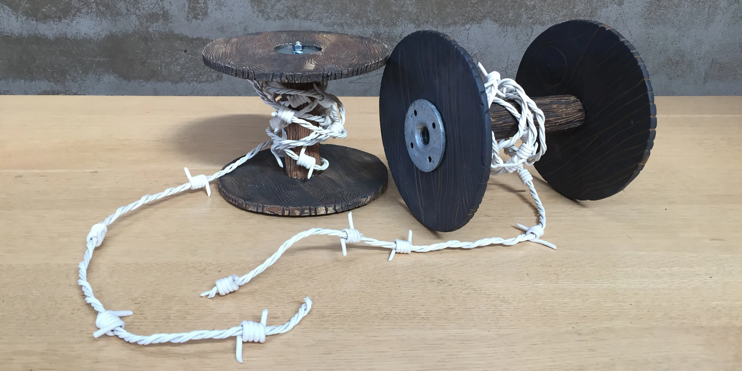 Century of Innovation Inside/Out 1 & 2, 2018 high fire stoneware and porcelain with telecom cable and steel I started this series because I was off put by the obsession some potters have with the "pure whiteness" of porcelain. The fact that porcelain objects were commonly used as gift items among some of history's most expansionist regimes - the Imperial Chinese court, the British Empire and the Nazis - imbues this quest for "purity" with a meaning I am not comfortable with. Digging into the history of barbed wire in the Post Civil-War era, and its use "taming the west" (expropriating lands from people who had historically had rights to them,) as well as its early use as a primitive telephone system giving ranchers weather information, cattle prices, etc. and aligning that with the history of how contemporary information technologies have been leveraged to create greater divides between those "inside the fence" and those "outside the fence."