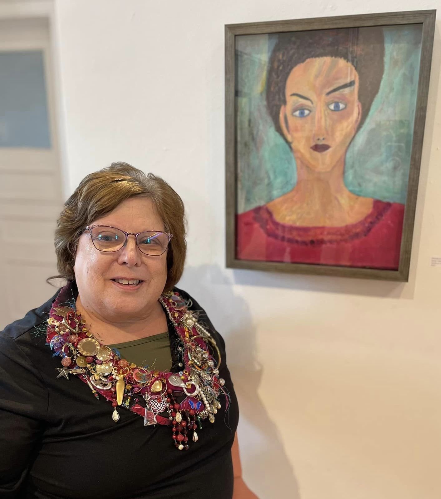 Renee Atkinson in front of her Portrait of Marie. Photograph by Deborah Benedic
