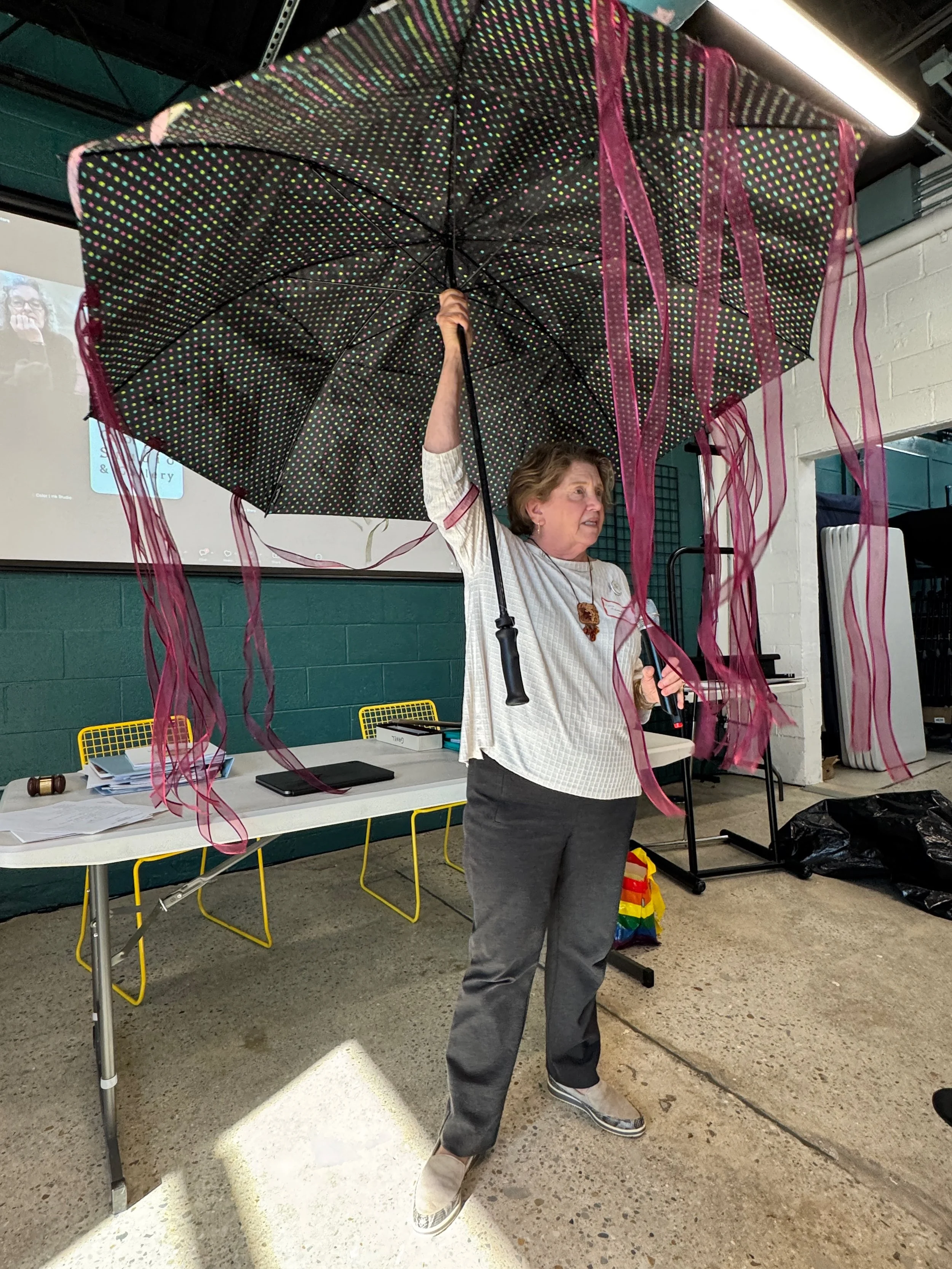  With Sue Shlom, Lynn Edwards Newman created this umbrella to illustrate the condition of women “confined under the umbrella of the male gaze.” Figures on the outside of the umbrella represent pressures on women to be pretty, fit, pleasing, better mo