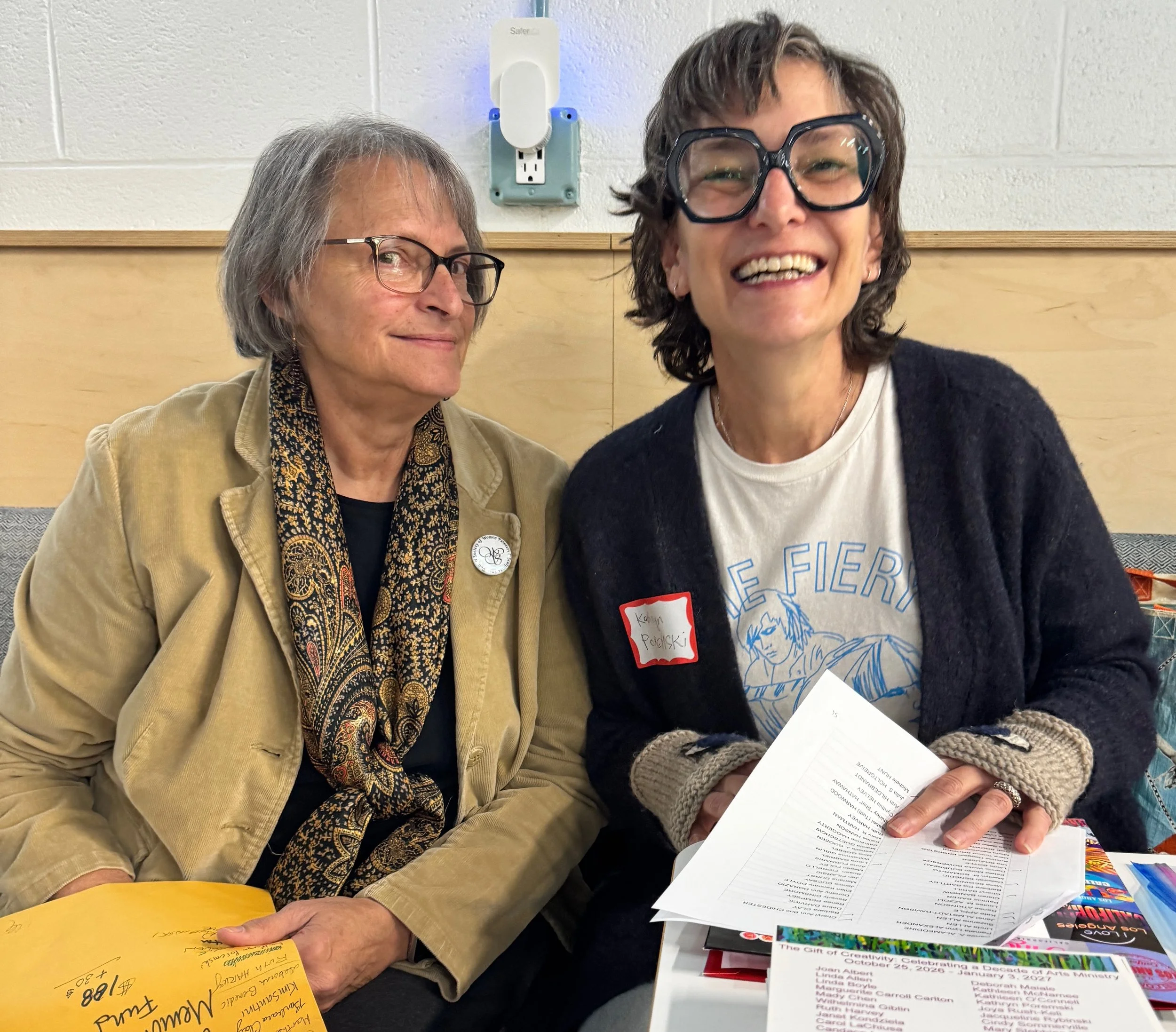  Theresa Moore, President, with Kathryn Poremski, distributing Membership Directories 