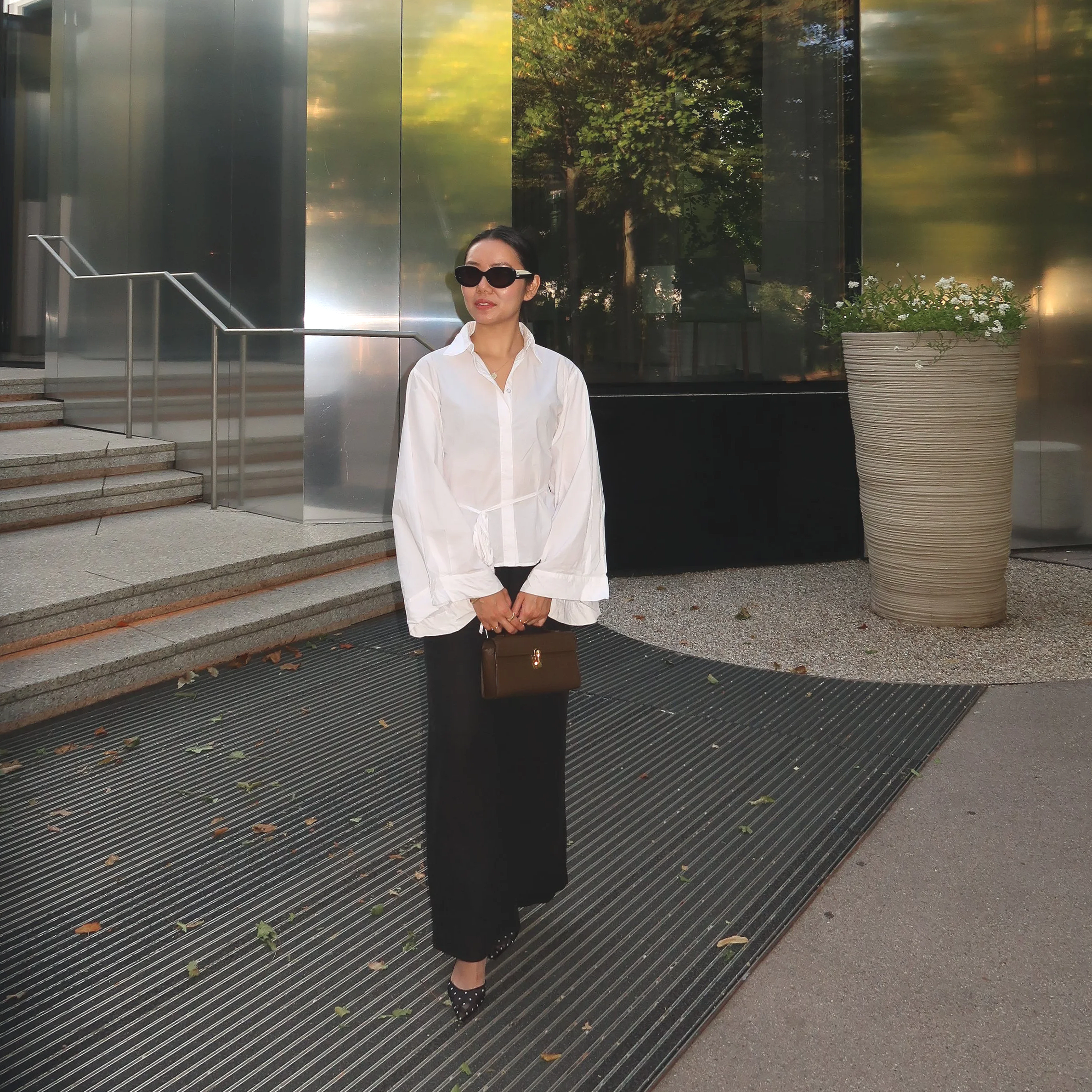 Top: Unknown  Pants: Faithfull The Brand  Shoes: Manolo Blahnik  Bag: Savette 