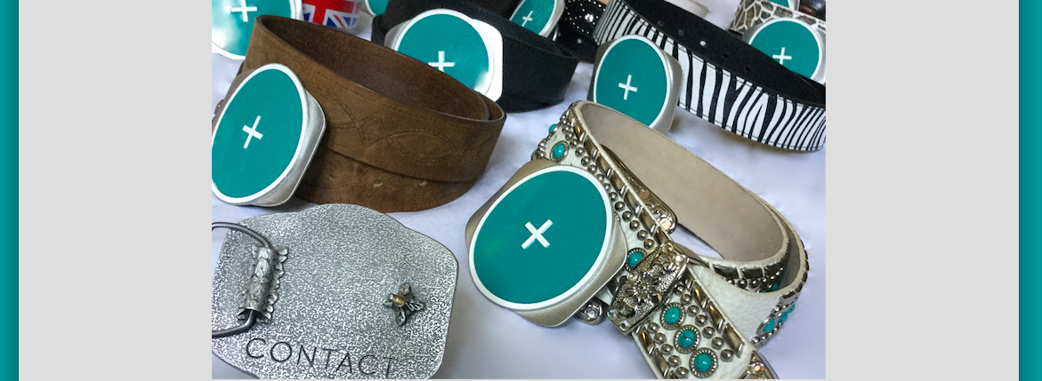 CONTACTCircleBeltBuckles @PowerofCONTACT OriginalMerchandiseCopyright_CONTACT_MercedezDeCastro LogoVisInc GraphicTaniaVolpeDesign CustomOlympicTrophies ManufacturerStrathCraft.png