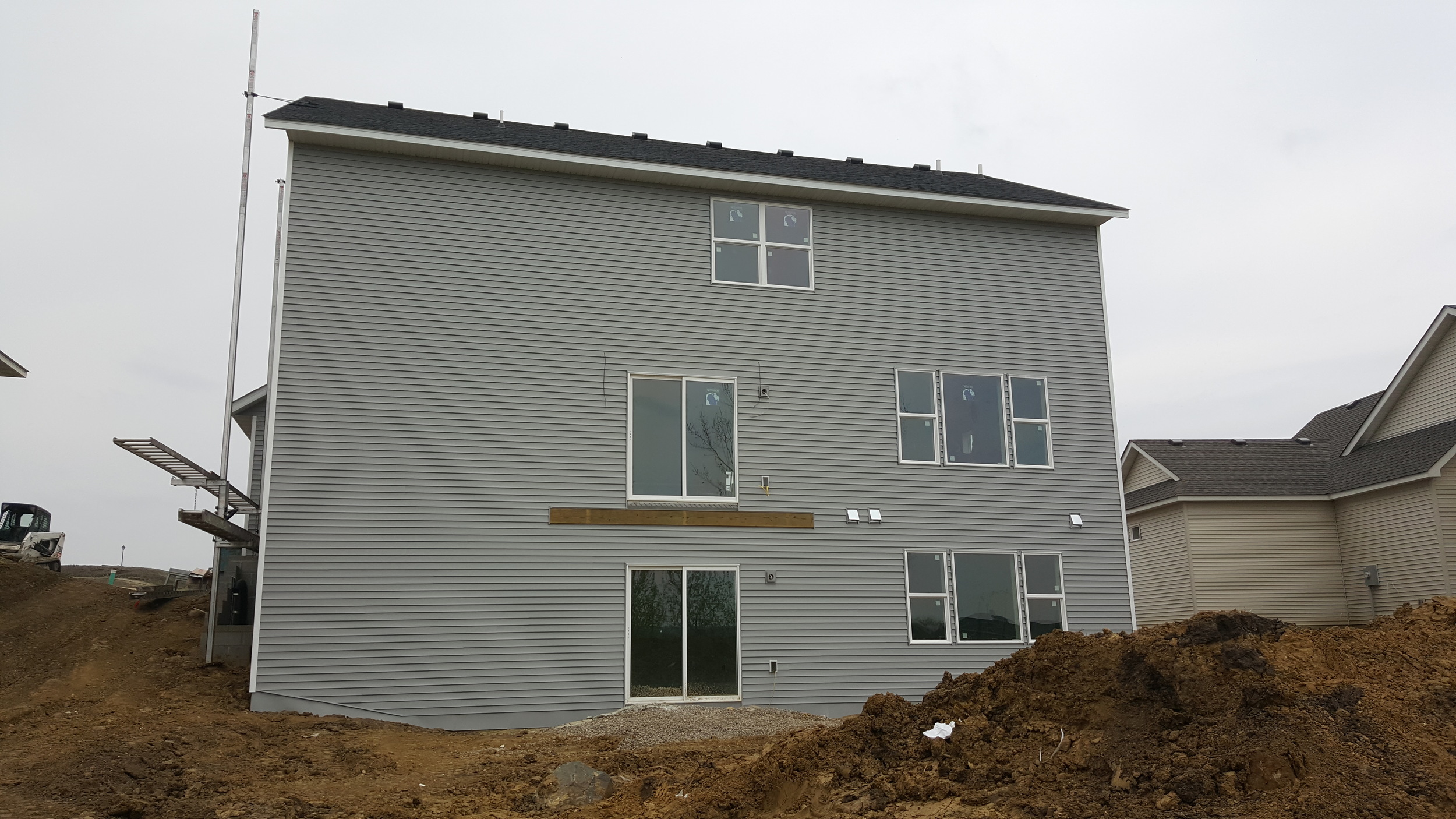 Rear Exterior Siding Going On - 4.21.2016.jpg