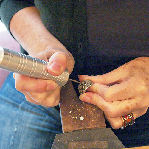 A foredom drill, powered by a foot pedal, is used to cut seats for diamonds or gemstones to be set in. 