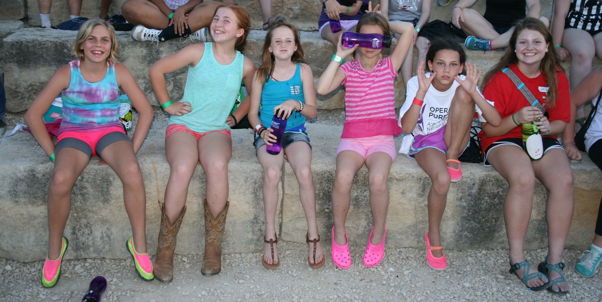 Lucia (2nd from left) and her cabin mates waiting for evening campfire to start.