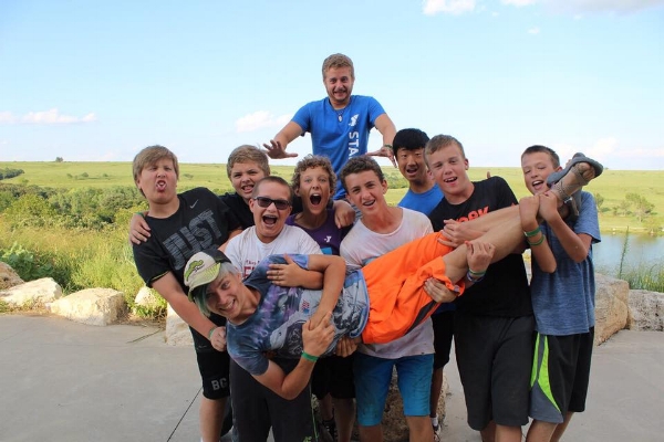 "Rainbow" (Tyce) gets a lift from some campers this summer.