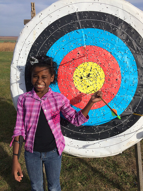 Families loved learning new skills at archery during last year's Harvest Family Camp.