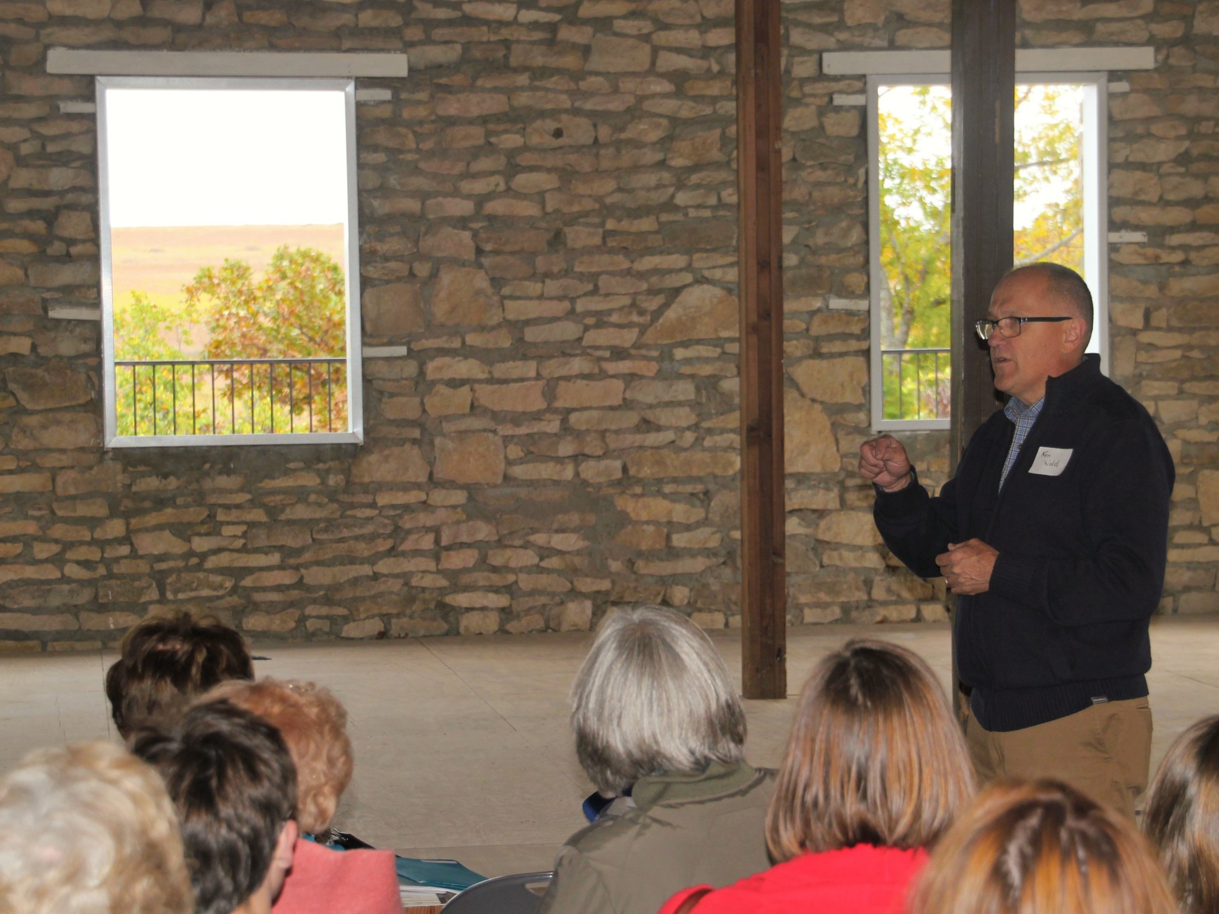 Ken speaks with visitors during Hutch Hall's renovation. The old wooden backstage was removed and the original views to the hills beyond was restored.