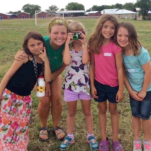 Lizzie, far left, getting to know her cabin counselor and new friends.