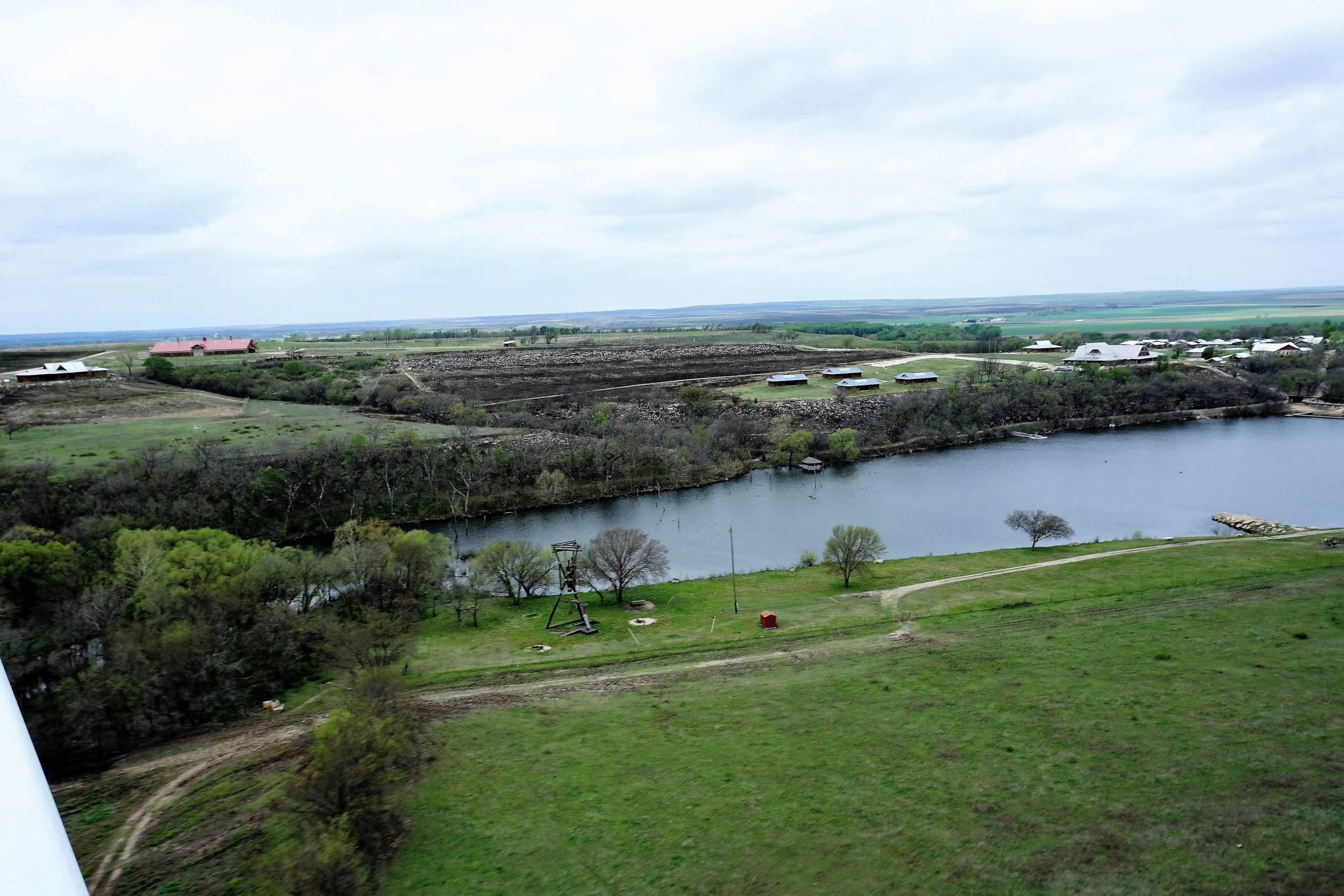 From this angle, you can see the hillsides facing the lake that were burned, revealing the rocky underlayment that the Flint Hills are known for.
