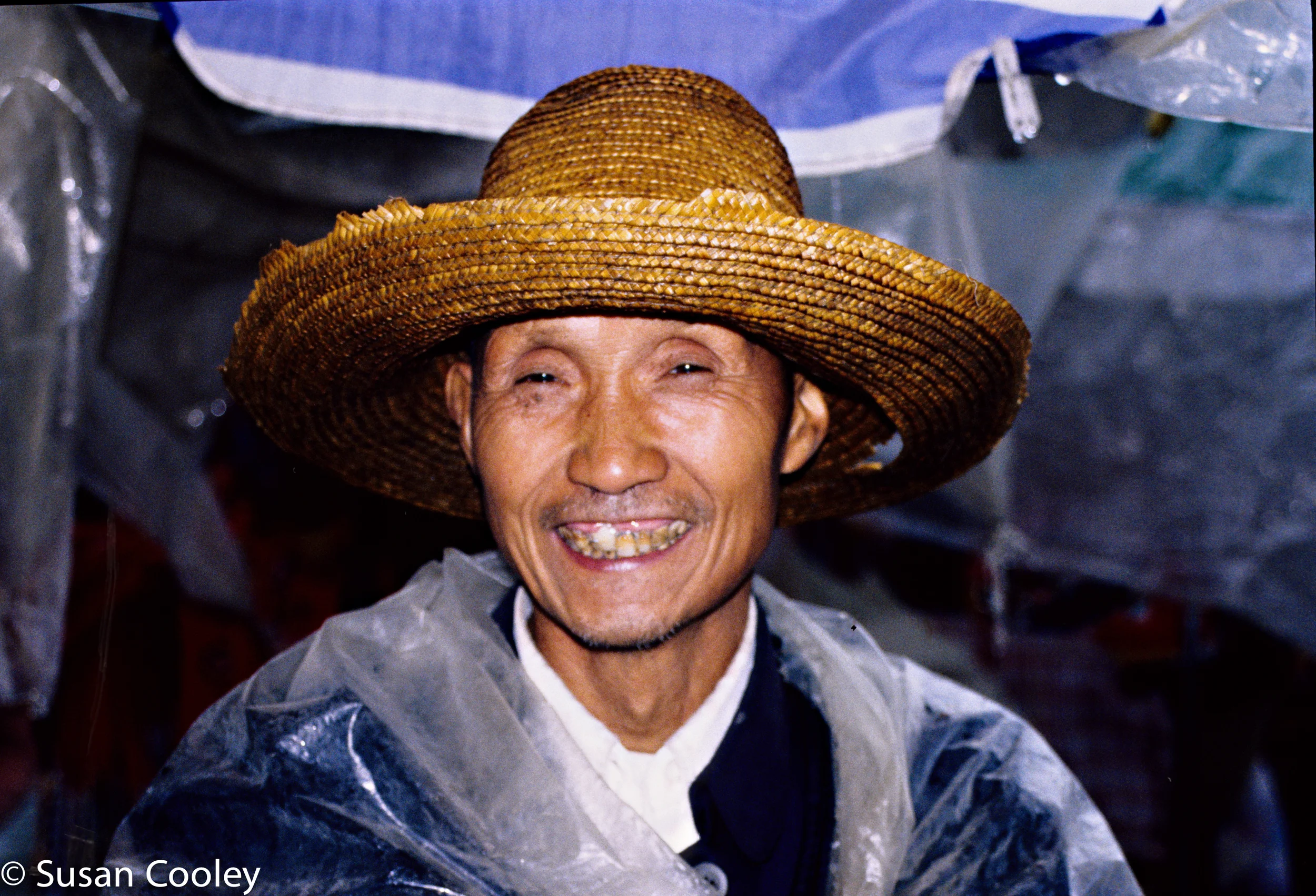 Market vendor in the rain, Shanghai