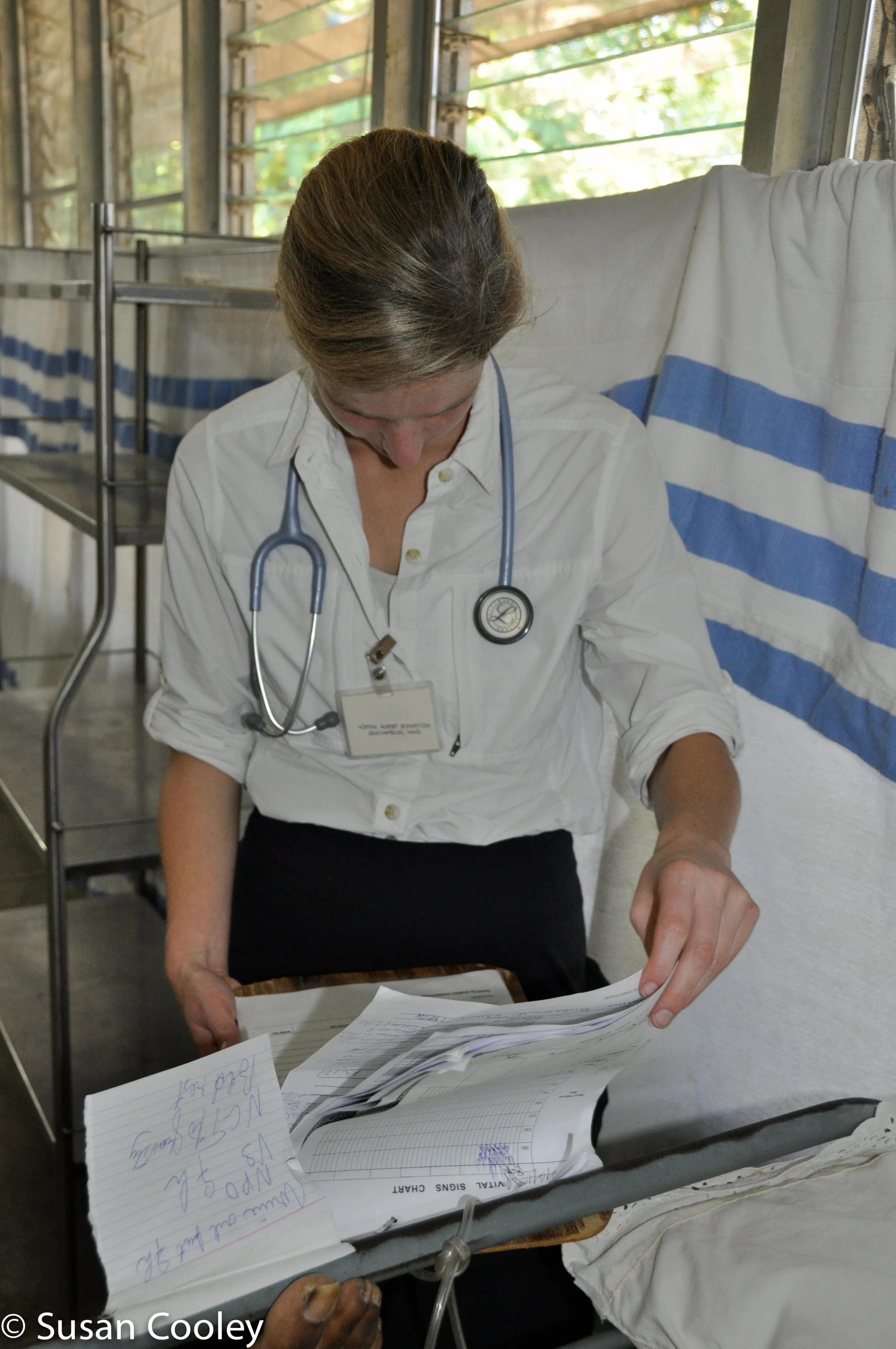 Like mother, like daughter.  Mary Senkel, RN. reviews a chart,  HAS, 2013.