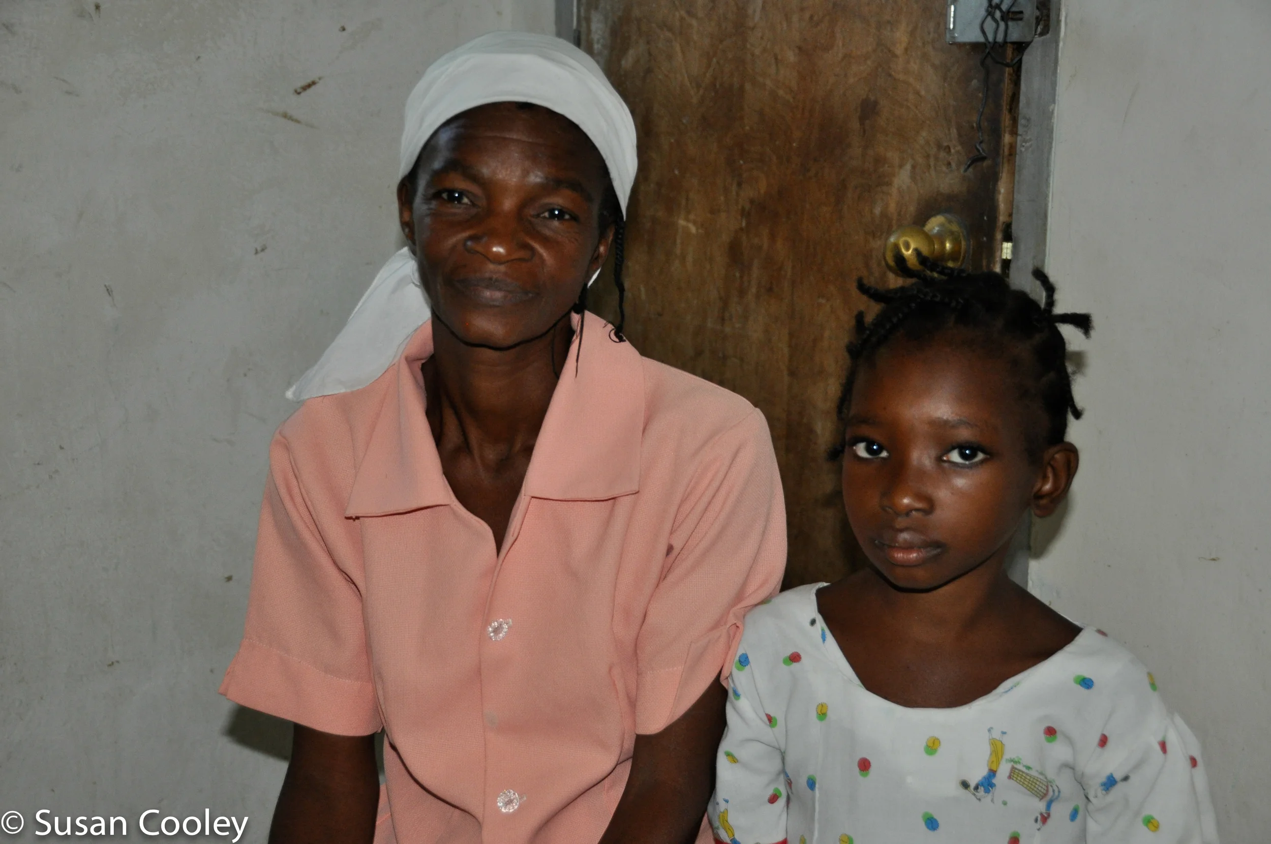 Grandmother and child wait for exam.