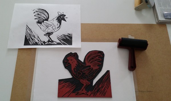 Freshly pulled print and linoblock inking station. No finger prints please - we're professionals! (cough...)