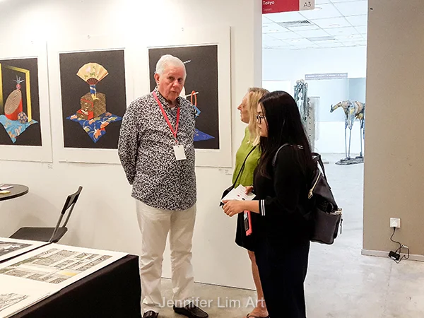 Gallery owner Mr. Tolman speaking about his selection of handmade prints by artists from Japan and abroad. 