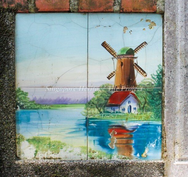 Longing to travel again? Holland can be found within Singapore if you know where to look. But why would such a scene be found on a Chinese tomb in Singapore? 
Also, it's likely that this tile was not made in Holland, but somewhere much closer in Asia