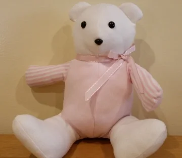 Thanks to the Memory Bear Project offered by the Bereavement and Family Guidance Program, we had two teddy bears made from Harumi's baby clothes. 