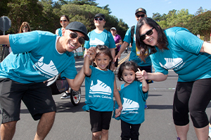 “Summer Scamper has become a family tradition. We started off with three of us. I Scamper-ed after we had Aria, and then again when I was pregnant with Mavis. The following year baby Mavis joined the team. Now our team keeps growing!” - Cecil with husband Randy and their two kids. Read their story on our blog .