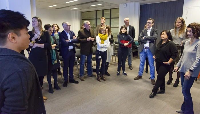 Nicole Mills , from Booking.com, getting everyone on their feet in Amsterdam 