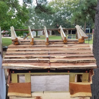 We will be putting copper down the center to cover the seam. And, we'll be adding an old window to the opening. This weekend's chores ;)