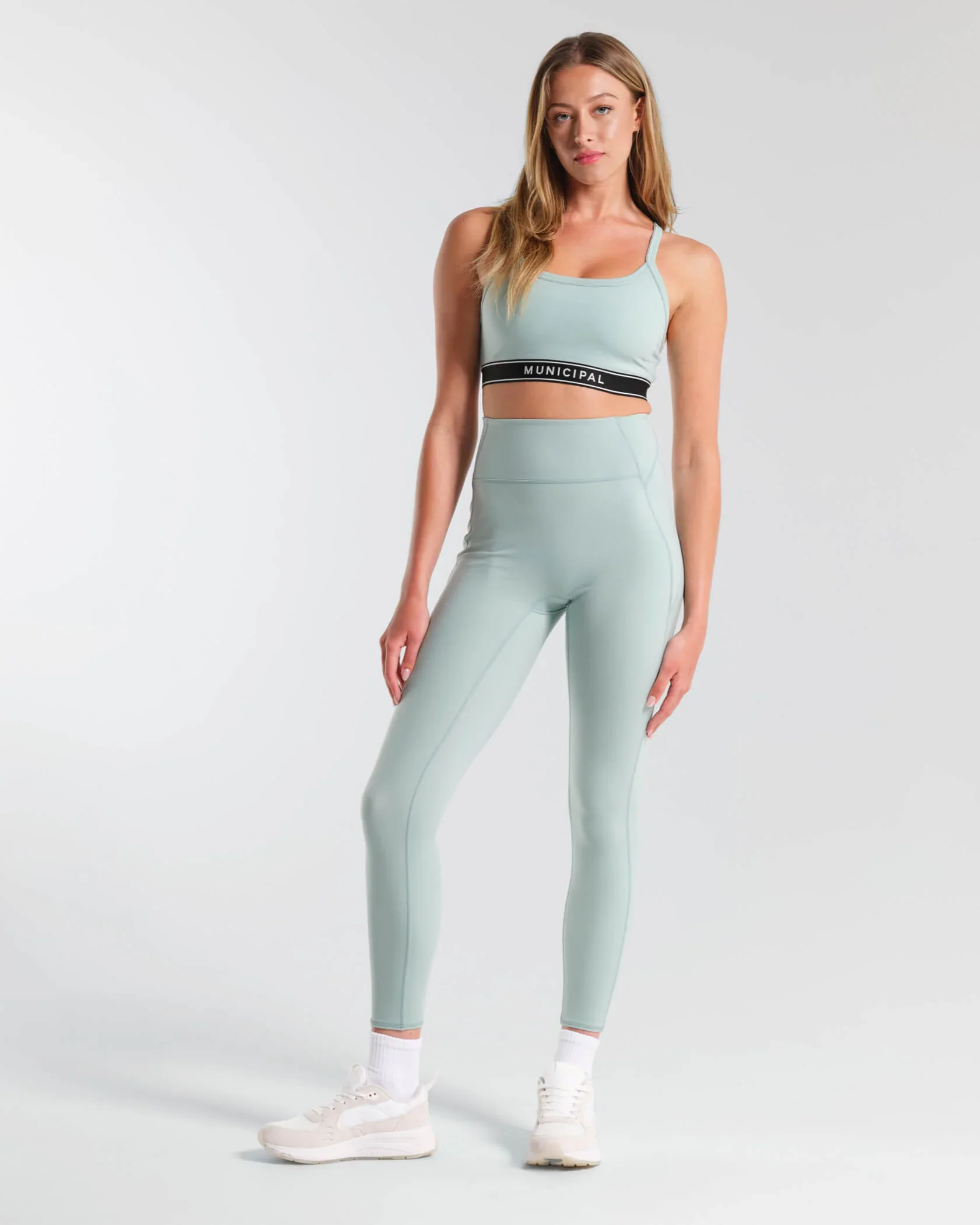 municipal-apparel_womens-motivate-strappy-bra_blue-sage_MWBRA101_outfit.jpg.webp