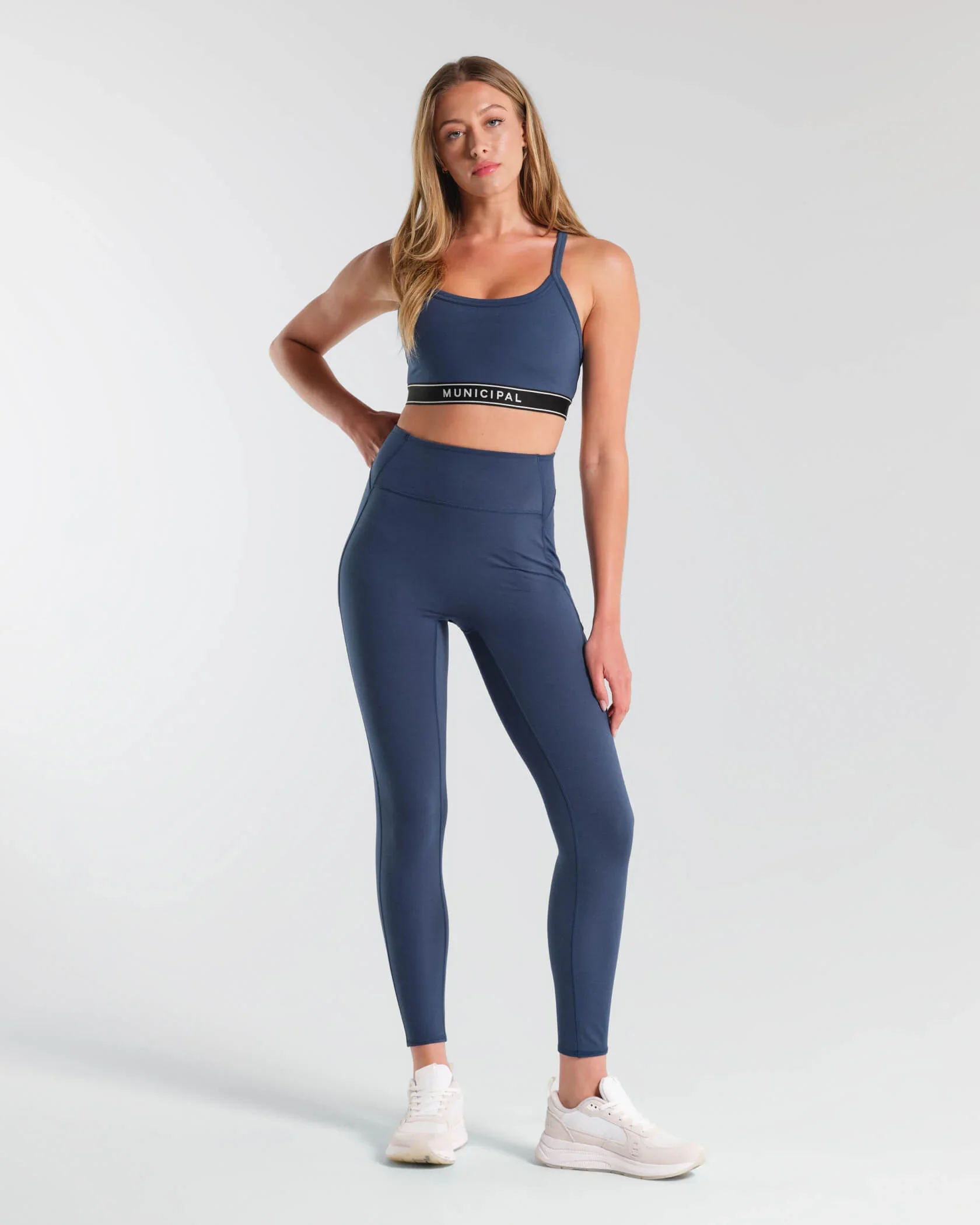 municipal-apparel_womens-motivate-strappy-bra_blue-wing_MWBRA101_outfit.jpg.webp