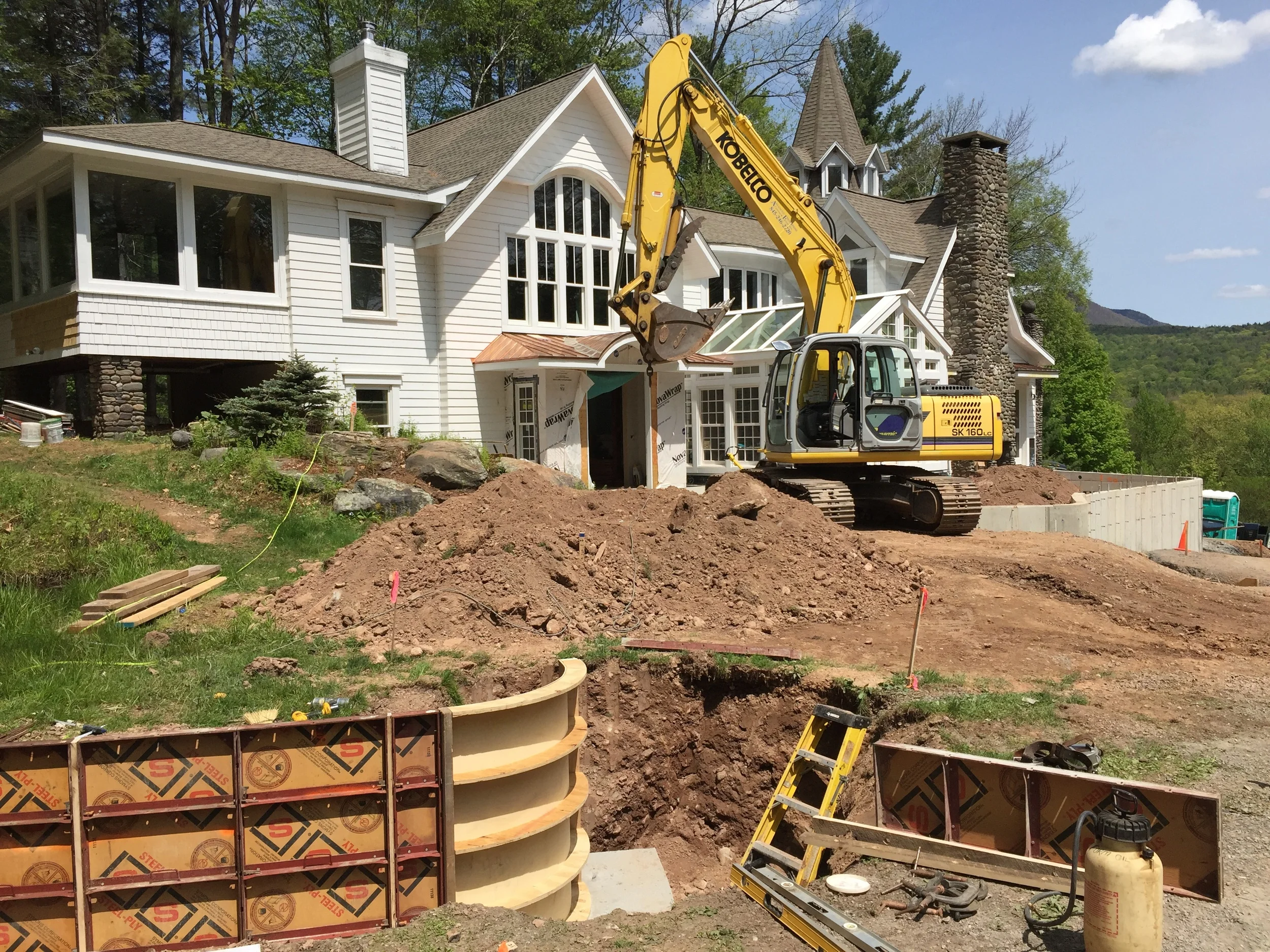 It's going to be a long sinuous wall that, when viewed from above, will resemble a guitar.