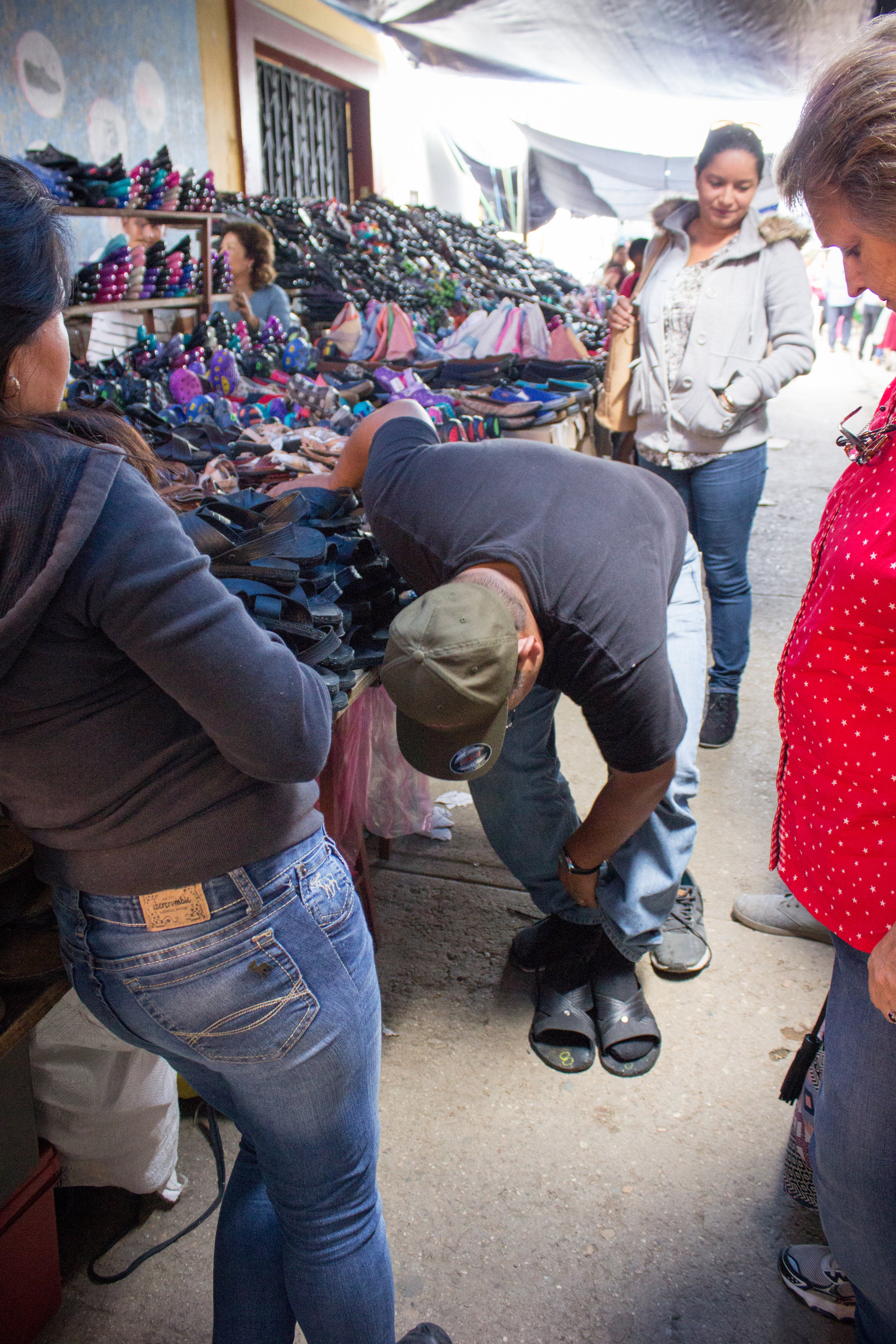 On June 27, Ilene, Junior, Maria, Manuel and I traveled to another part of Oaxaca. Here, Junior tries shoes on in a market where we stopped along the way.