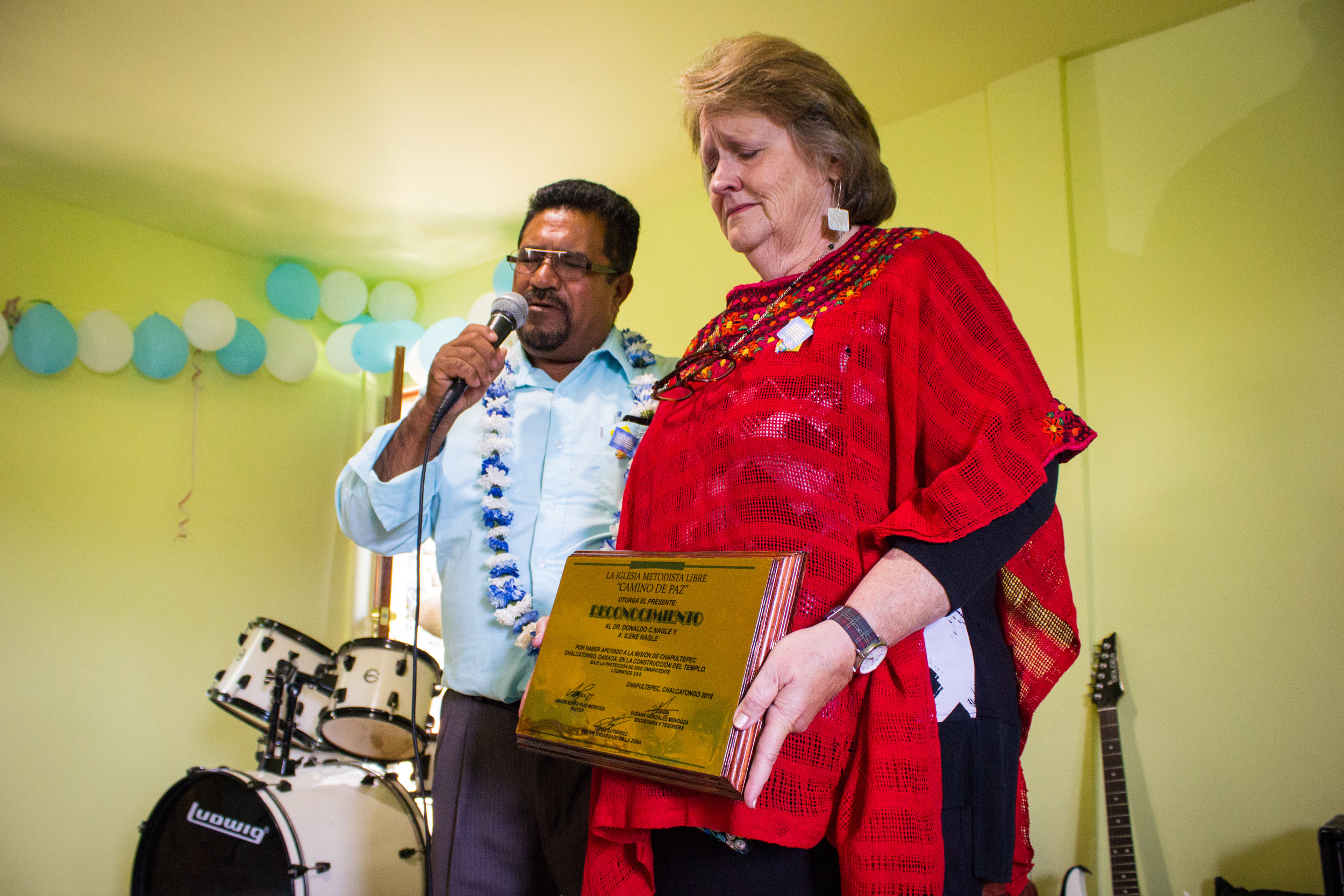  Ilene is overwhelmed when Senen and the other pastors present her with a plaque of gratitude. It is no small feat for them to honor her in this way, in a village where items like this are not made locally. 
