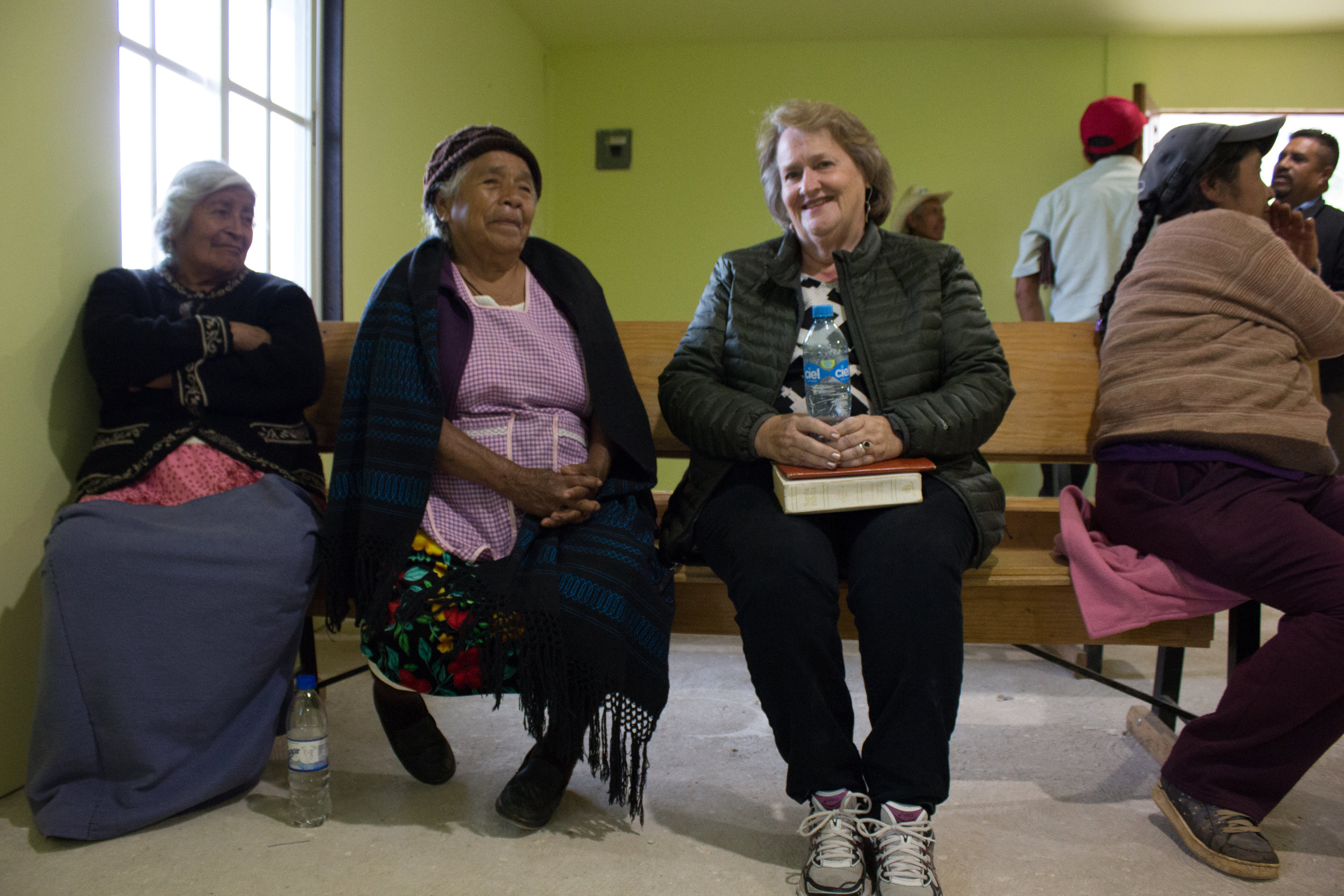 Ilene brings medicine and other items on her trips. She has met many people over the years, such as these women, and is familiar with their needs.