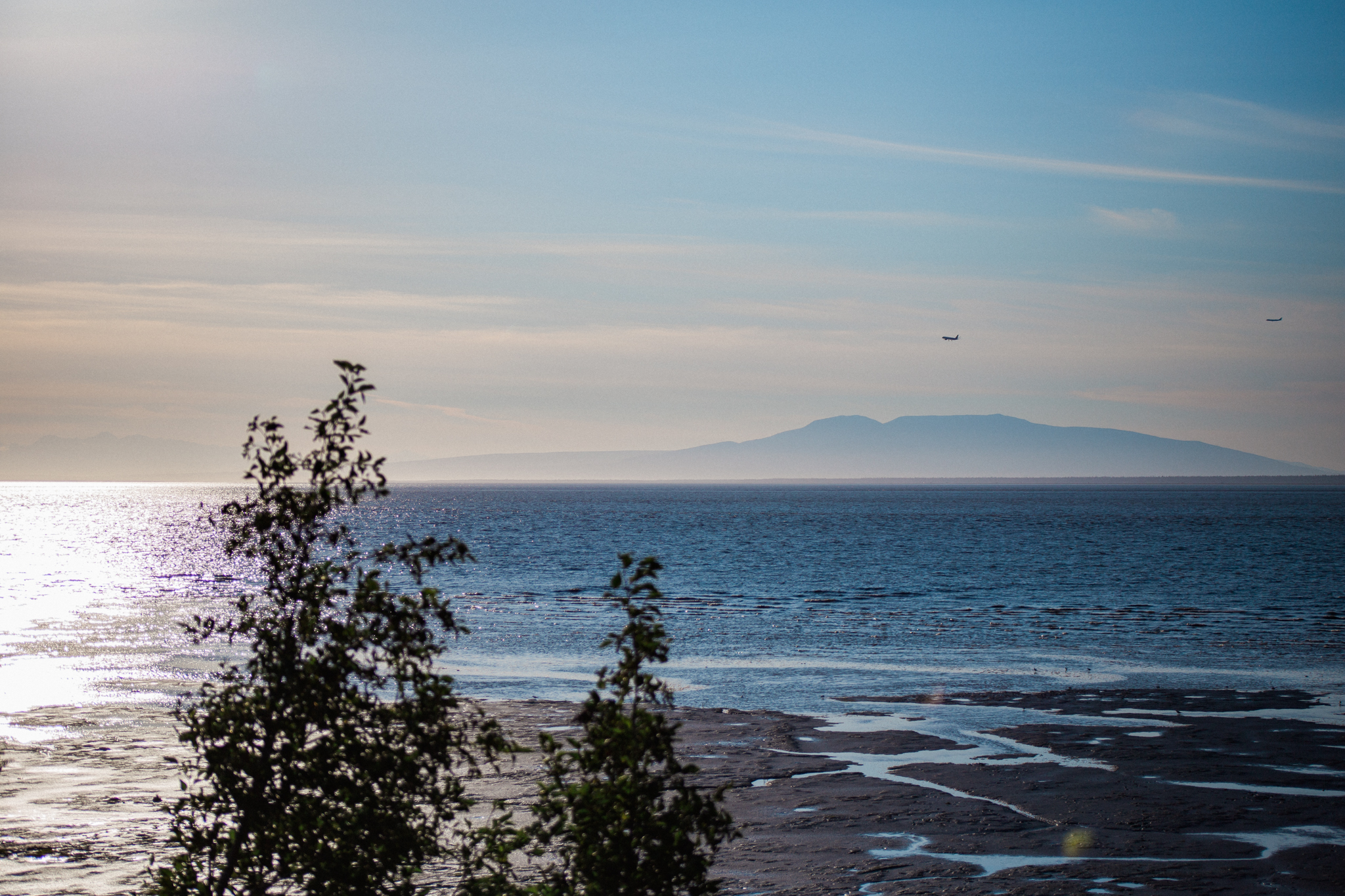 Watching airplanes fly in over the beach in Anchorage. 