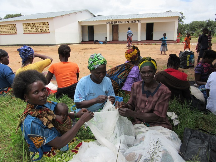 These women are fixing & enhancing bed nets, which are a very important item in zambia, as they one of the bigger defenses against Malaria.