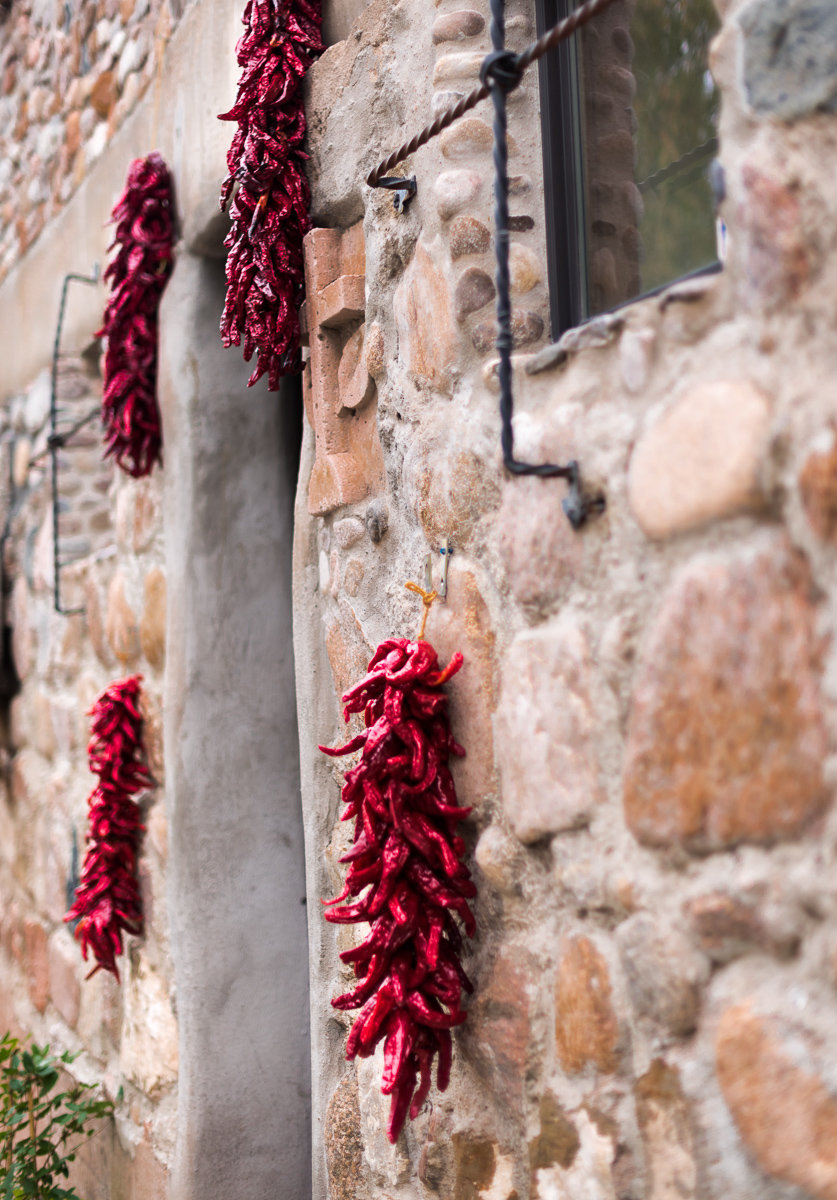 Chile Ristras on Stone Building