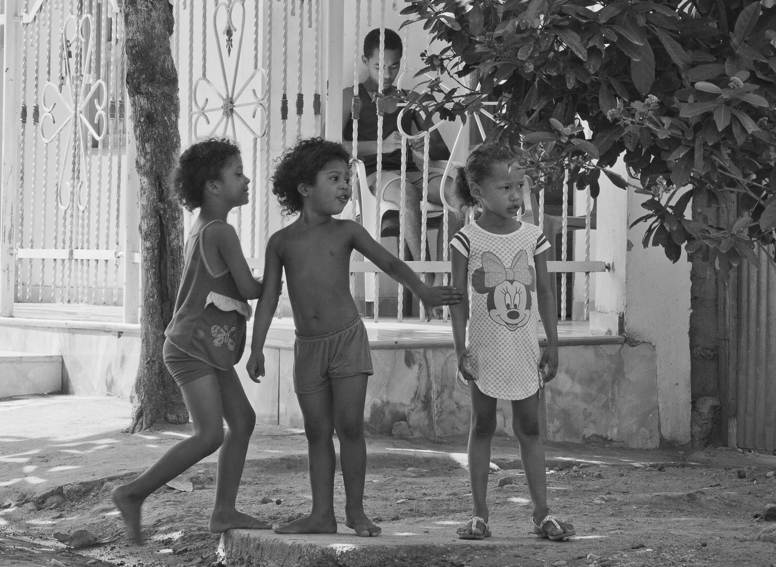  In this image girls are playing in front of a re-contructed house, they represent the vigorous life of the emerging town after fourteen years of rebuilding done step by step by the demanding enterprise of their parents work. 