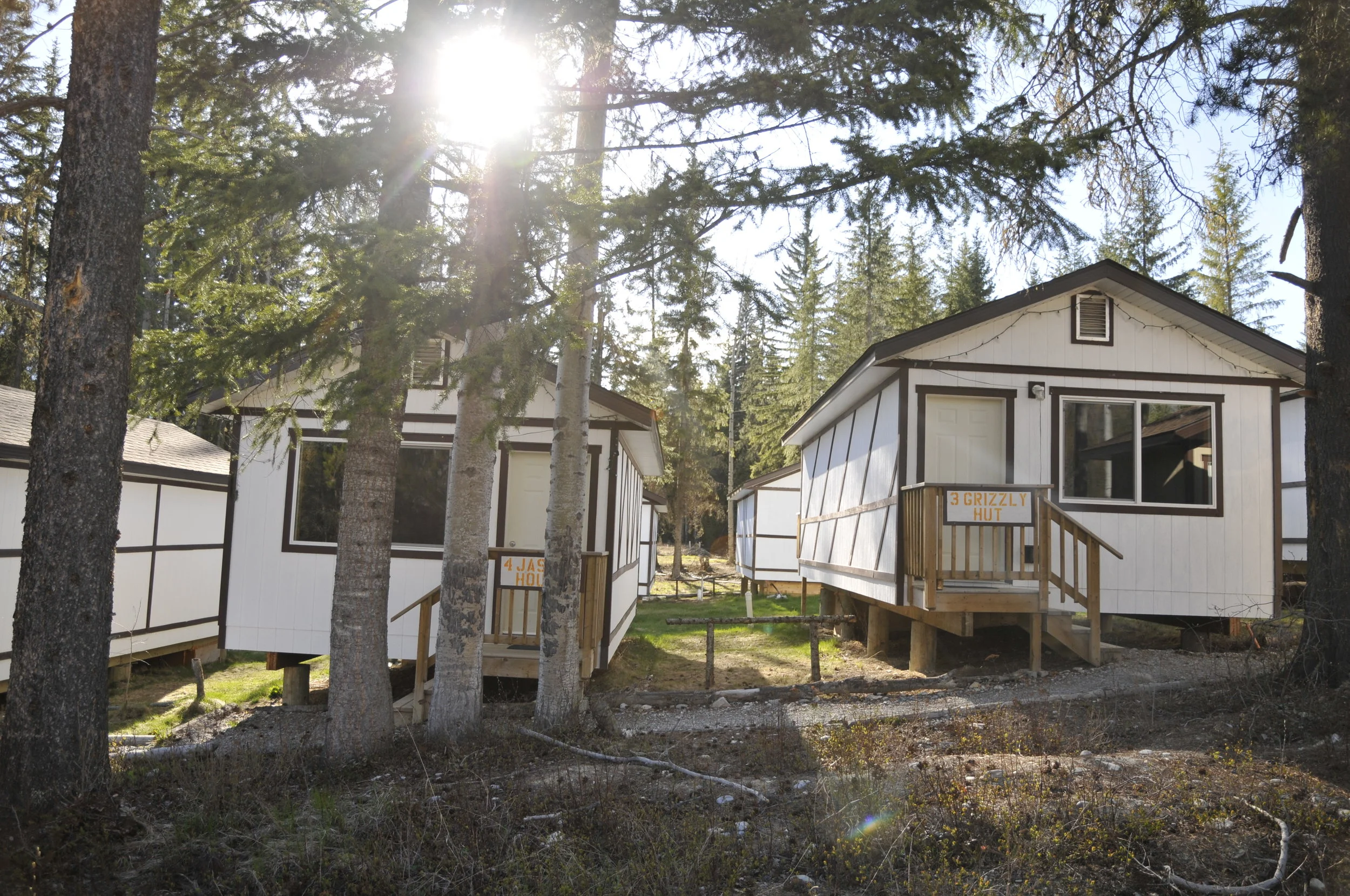 The front cabins with the setting sun behind.