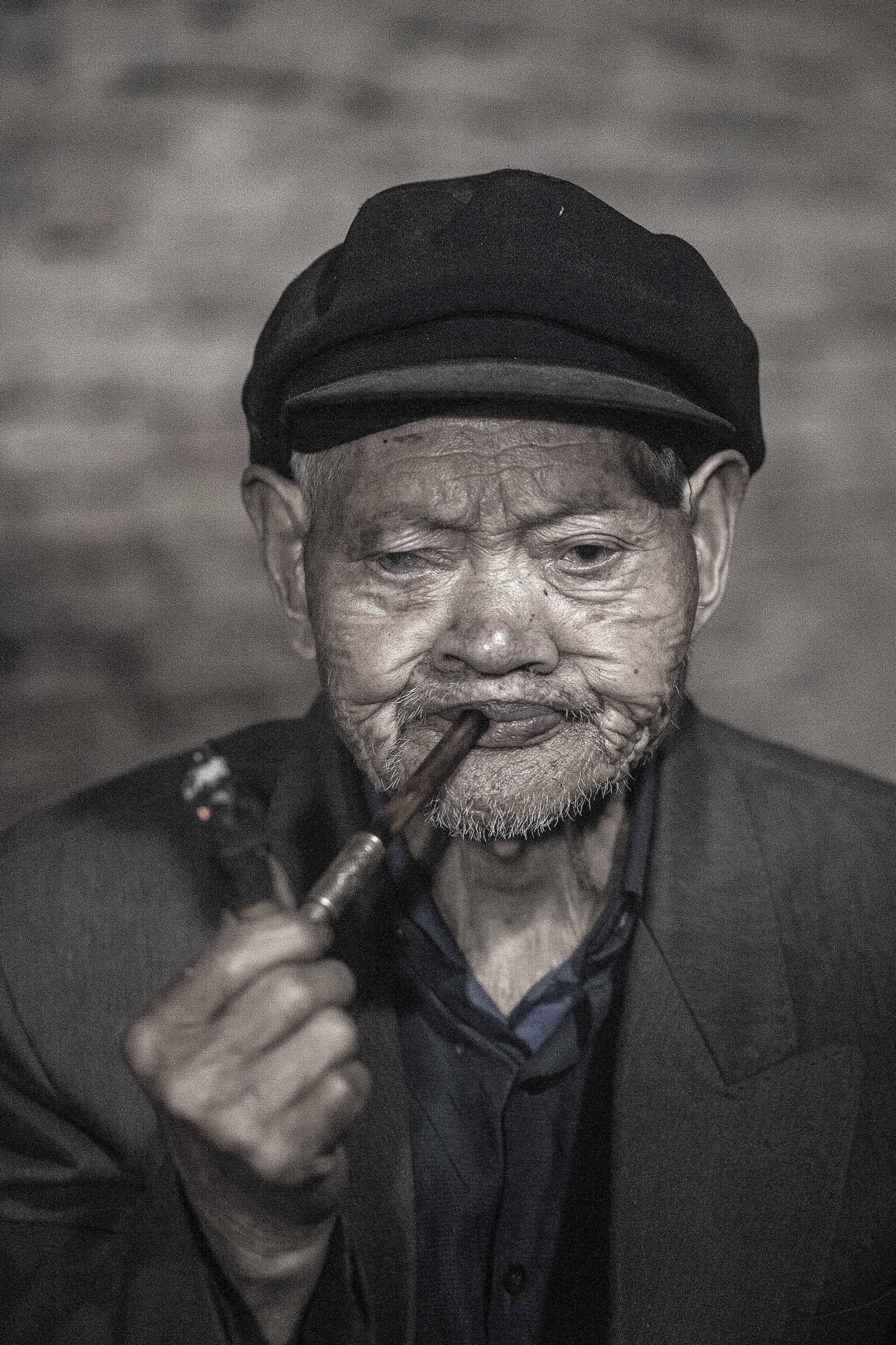 old man smoking puckered msaller.jpg