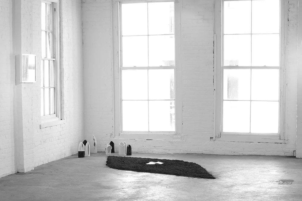 ICONOLOGY . 2012. Handbuilt porcelain, wood, gesso, acrylic paint, soil, a sacred book. Dimensions variable