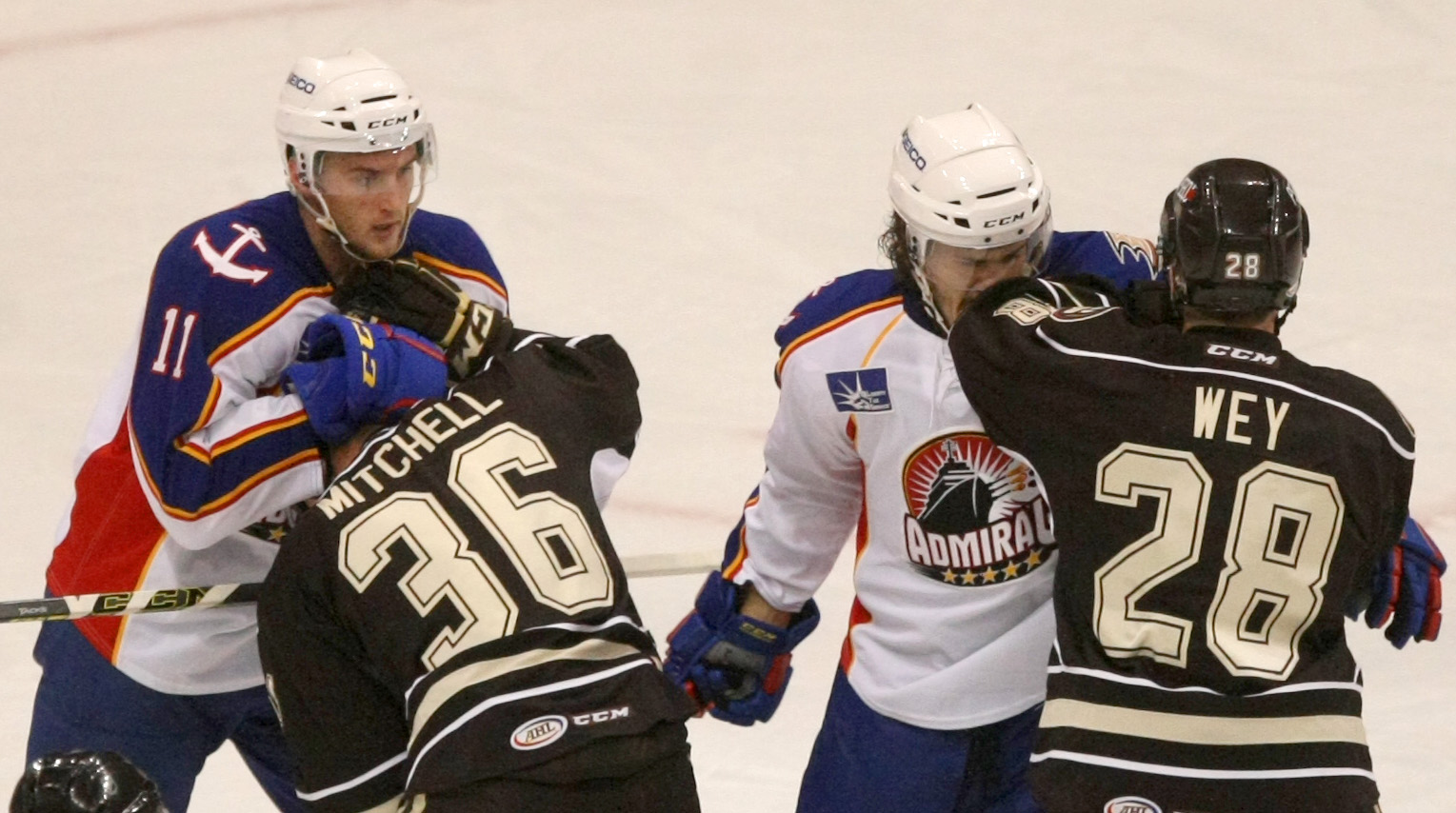 Norfolk's Stefan Noesen, background left, and teammate Mat Clark mix it up with Hershey's Garrett Mitchell, left, and Patrick Wey in the first period, Saturday, Oct. 11, 2014 at Scope in Norfolk. (Jason Hirschfeld | For The Virginian-Pilot)