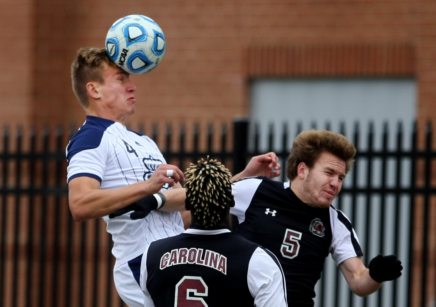 Old Dominion's David Macsicza, left, heads a ball out of the box away from University of South Carolina's Mahamoudou Kaba (cq), center, and Koty Millard during second half action of ODU's 2-1 win over USC to claim the Conference USA Men's Soccer Final, Sunday, Nov. 16, 2014 at ODU in Norfolk. (Jason Hirschfeld | For The Virginian-Pilot)