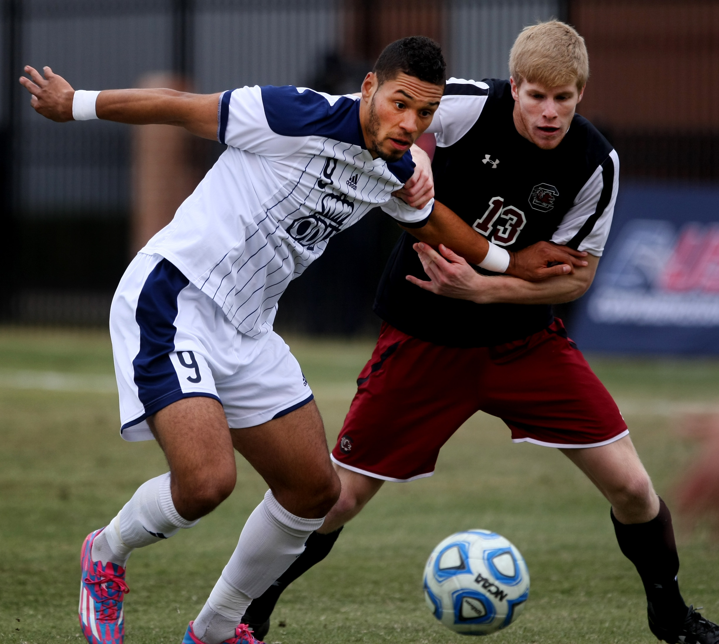 Old Dominion's Sidney Rivera, left, and University of South Carolina's Braeden Troyer battle for possession during first half action of ODU's 2-1 win over USC to claim the Conference USA Men's Soccer Final, Sunday, Nov. 16, 2014 at ODU in Norfolk. (Jason Hirschfeld | For The Virginian-Pilot)