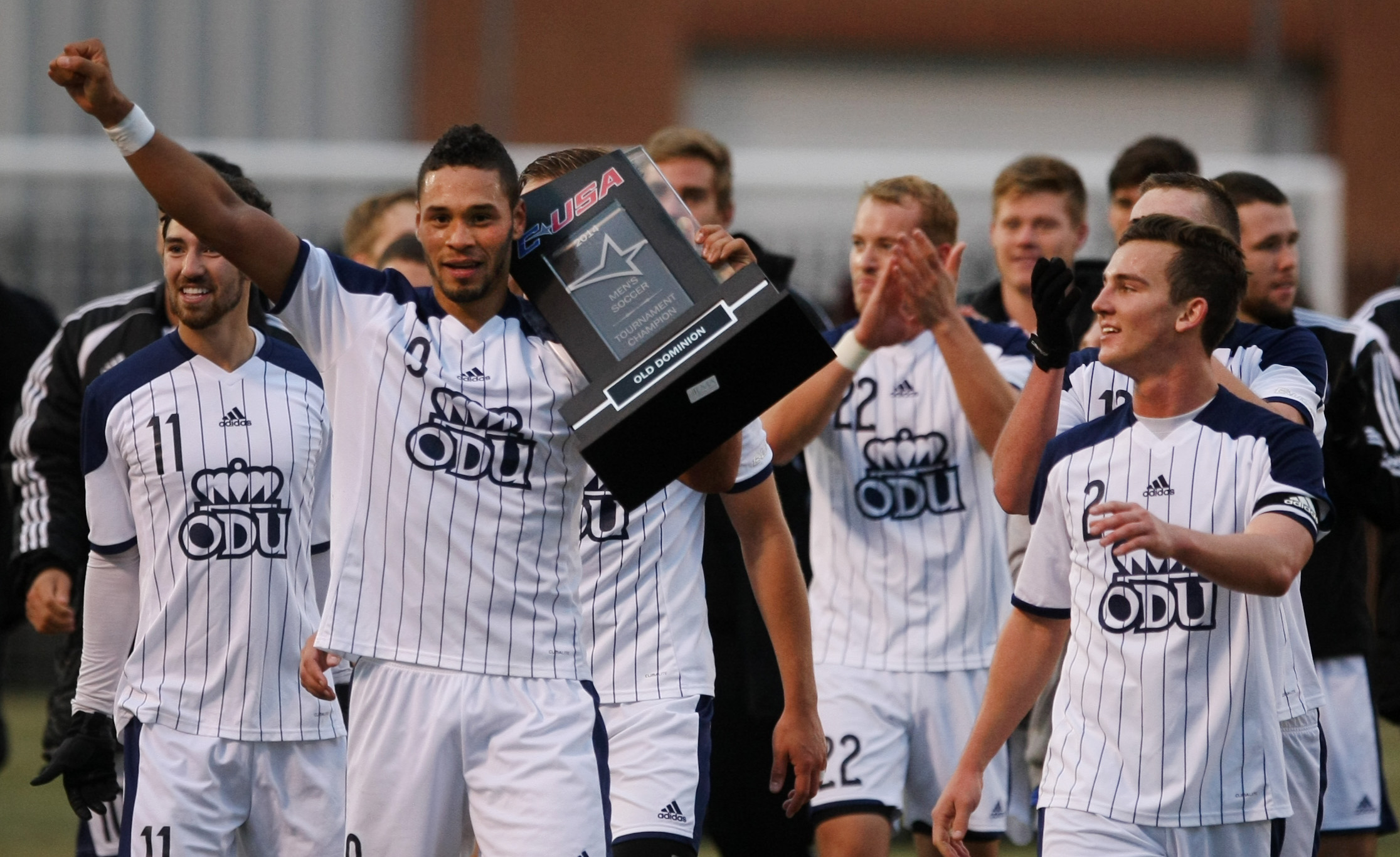 Old Dominion players, led by Sidney Rivera (with arm out) celebrate after ODU's 2-1 win over University of South Carolina to claim the Conference USA Men's Soccer Final, Sunday, Nov. 16, 2014 at ODU in Norfolk. (Jason Hirschfeld | For The Virginian-Pilot)