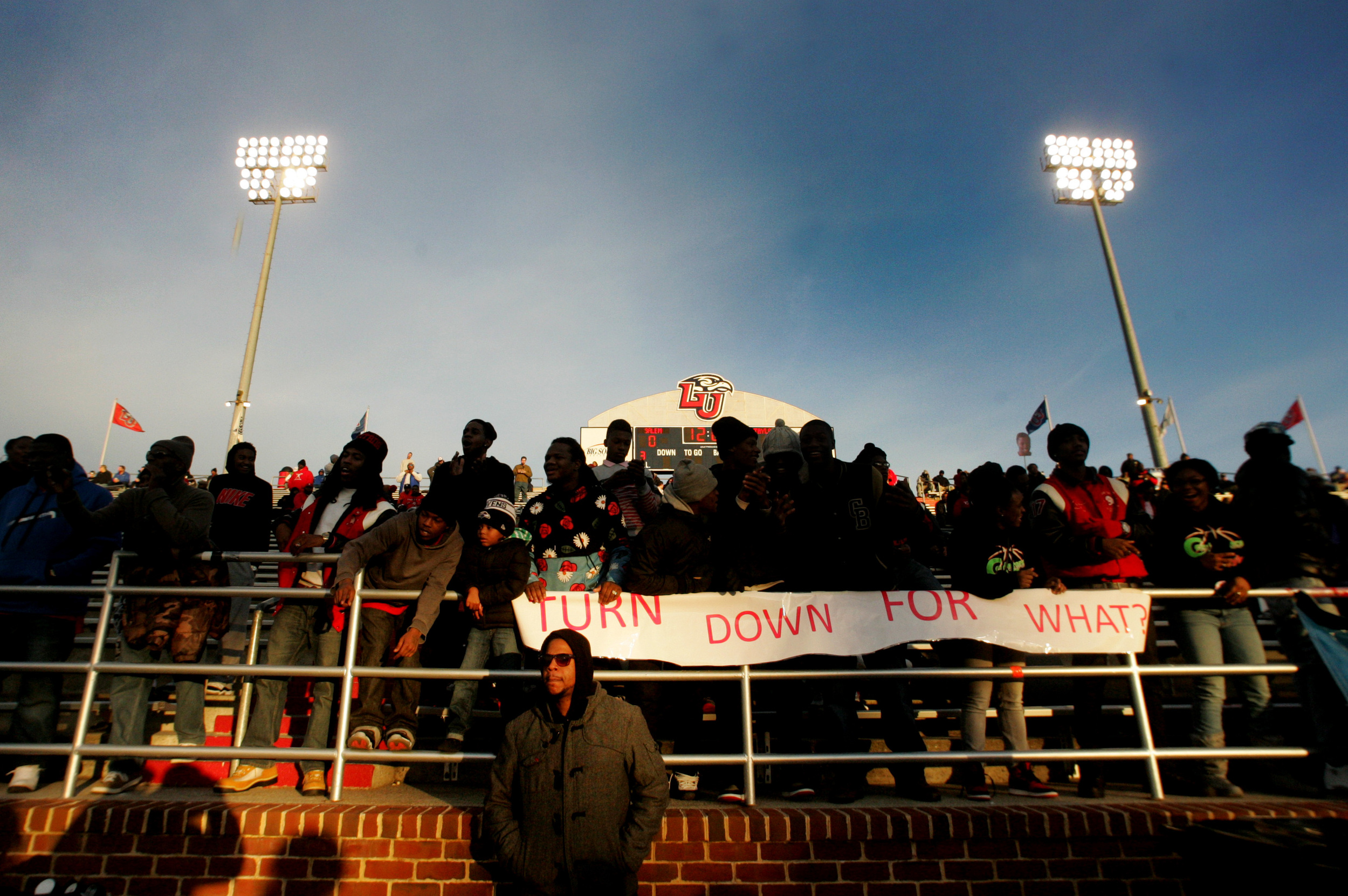 Demarius Wilson, a school administrator, waits for the Lake Taylor Titans to enter field prior to the start of their championship game against Salem, Saturday, Dec. 13, 2014 at Liberty University in Lynchburg.