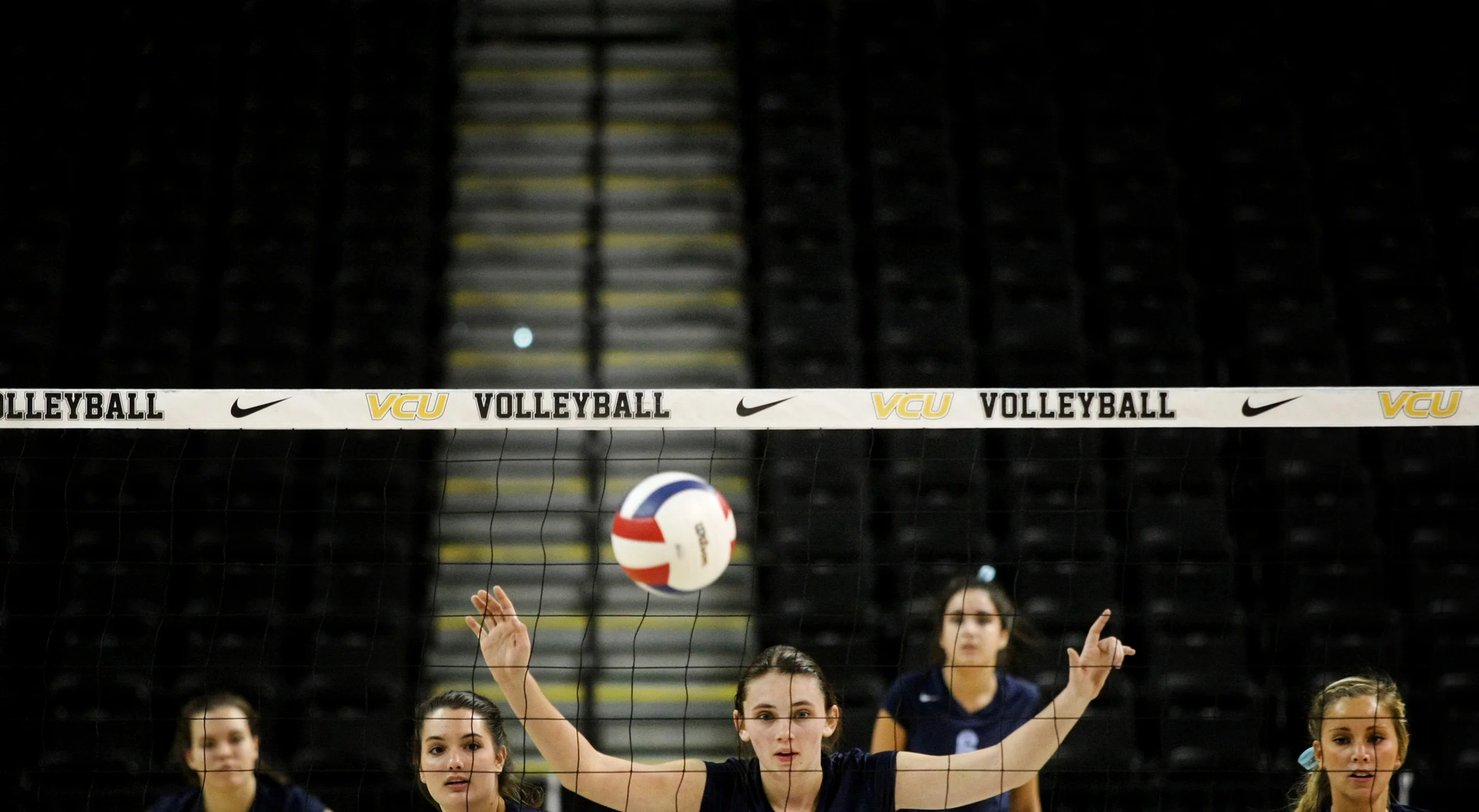 First Colonial's offense awaits a James Madison serve in the fifth set of which First Colonial would win to beat James Madison to claim the Group 6A girls volleyball championship, Friday, Nov. 21, 2014 at the Siegel Center in Richmond. (Jason Hirschfeld | For The Virginian-Pilot)
