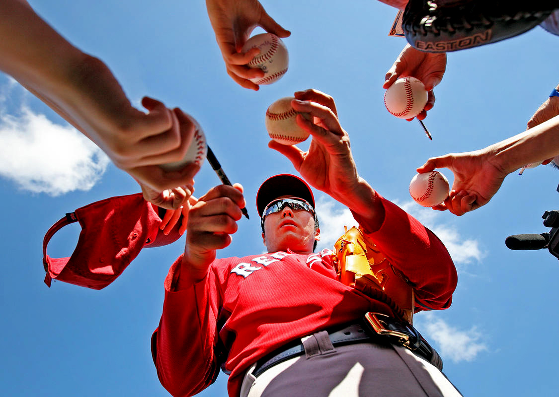 Boston Red Sox pitcher Koji Uehara signs autographs for fans at JetBlue Park in Ft. Myers, FL. 