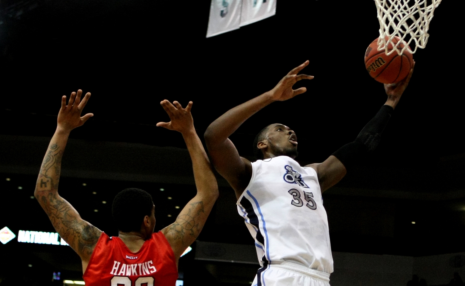 Old Dominion's Jonathan Arledge drives past Illinois State's Deontae Hawkins (23) during the first half of an NCAA college basketball game in the National Invitational Tournament, Monday, March 23, 2015 in Norfolk, Va. (AP Photo/Jason Hirschfeld)