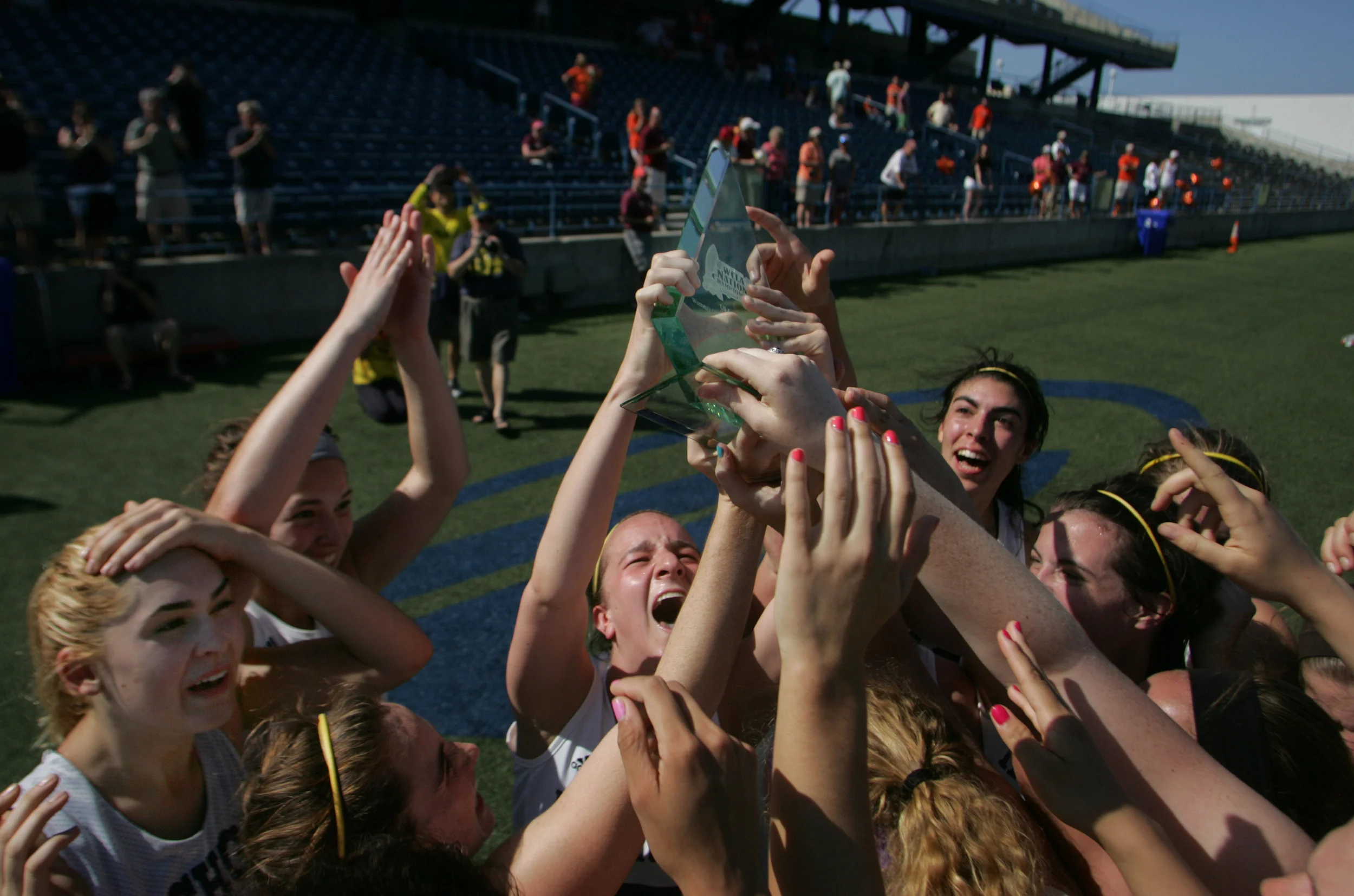 The Michigan women's lacrosse team celebrates after beating Virginia Tech 8-3 to win the national championship, Saturday, May 9, 2015 at the Sportsplex in Virginia Beach. 