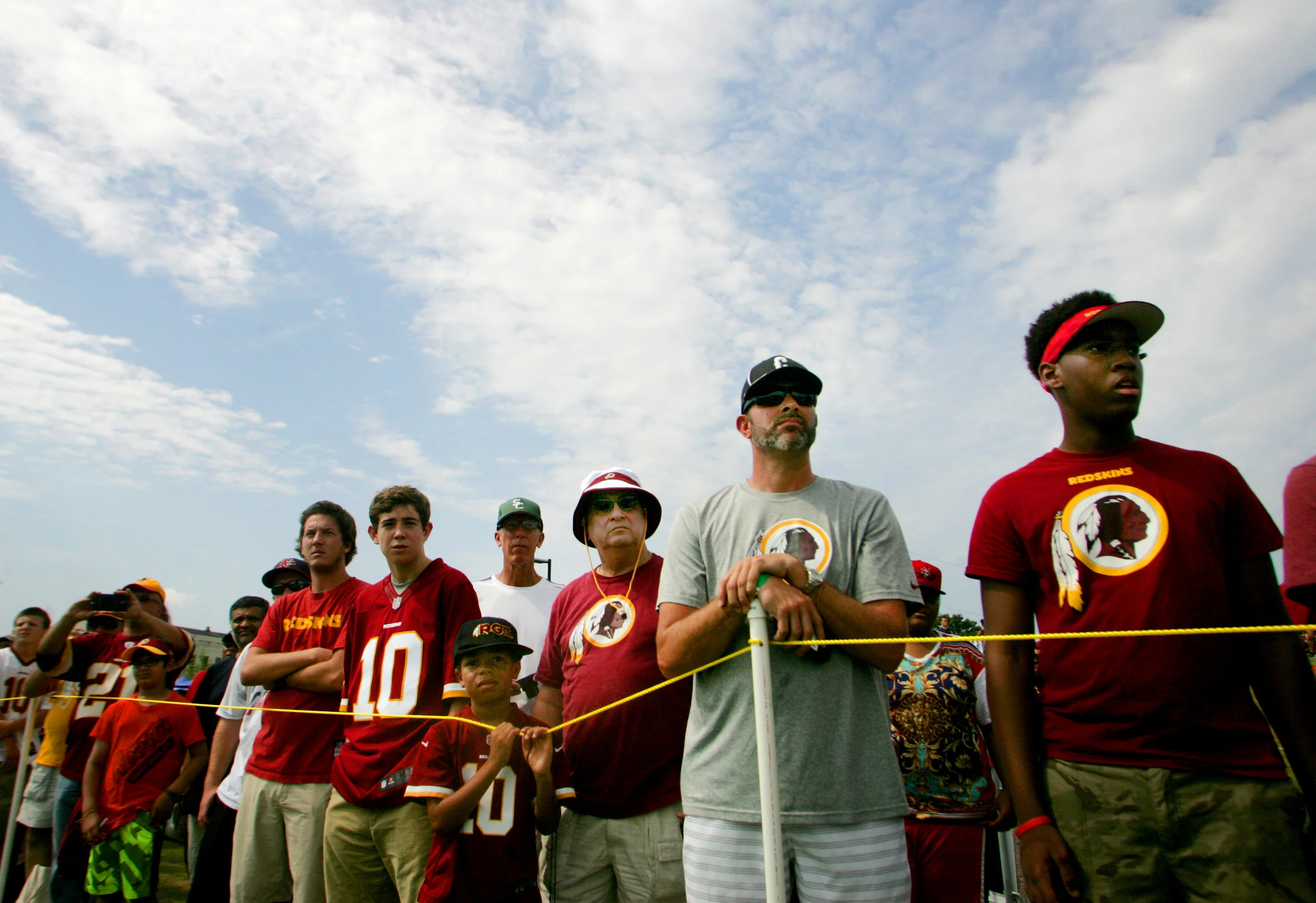 Washington Redskins fans watch from the sidelines during the team's NFL football training camp in Richmond, Va., Thursday, July 30, 2015. (AP Photo/Jason Hirschfeld)