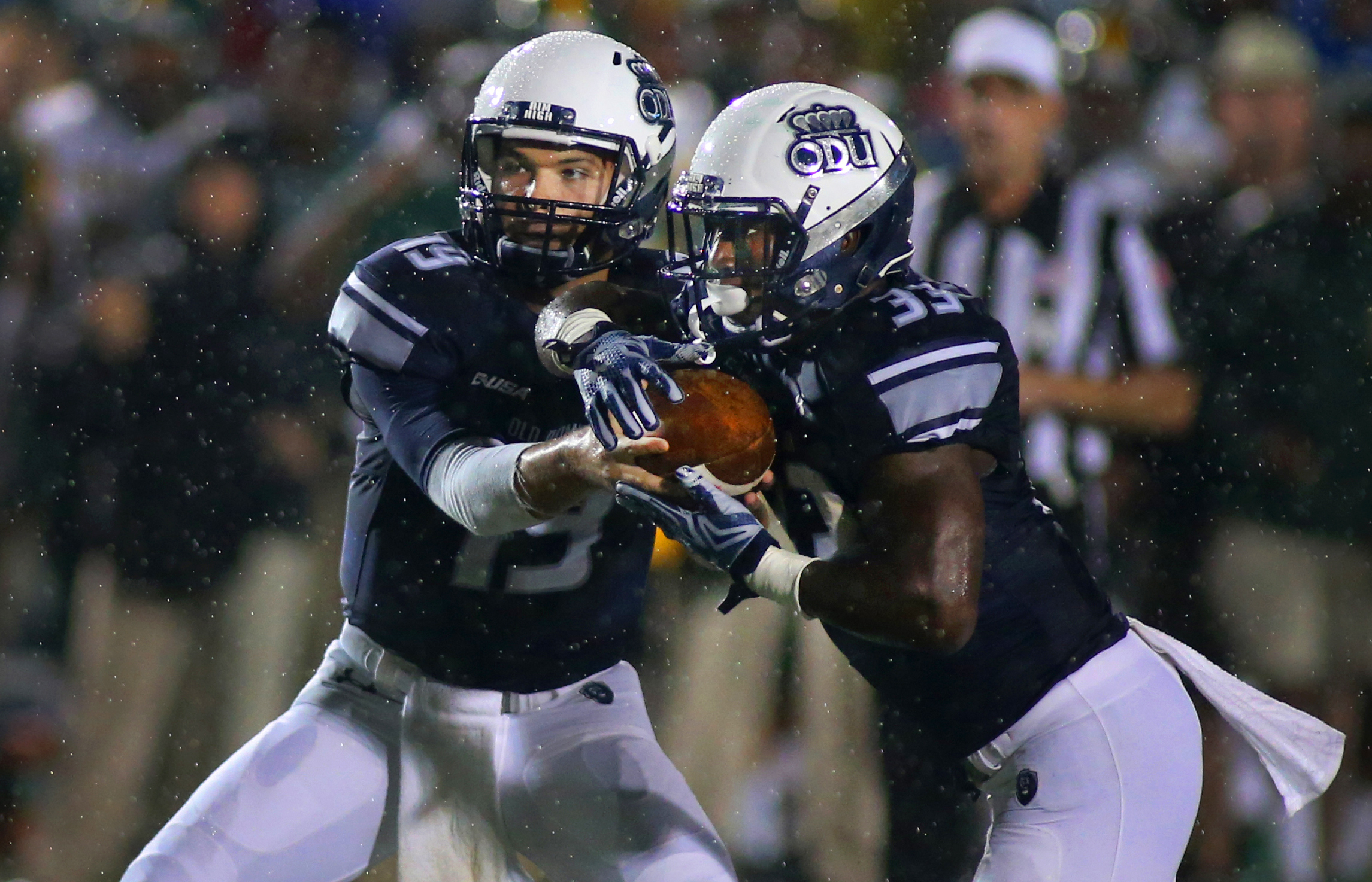 Old Dominion quarterback Shuler Bentley, left, hands off to running back Ray Lawry while playing Norfolk State. Larry would score on the play in the closing minutes of the first half, Saturday, Sept. 12, 2015 at Foreman Field in Norfolk. 